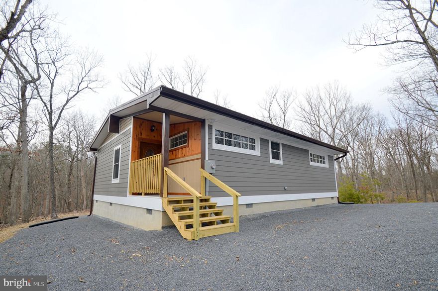 Remarkable newly built cabin.  Much thought and consideration went into this custom built cabin.  Outside features 3 plus wooded acres, a metal rood, hardi plank siding, and a shed with electric. Real barnwood trim accents adorn the interior.  Tile flooring on the screened porch and in the bathrooms are nice touches.  Mini split units provide heat and cooling.  A central focal point is the beautiful wood accents and breakfast bar.  Tongue and groove pine and cedar really make the look fantastic.  Lots of natural light from the windows also.  Full sized laundry room, and a conditioned utility space are bonus features.  All of this and in a great location also.....schedule your appointment today!