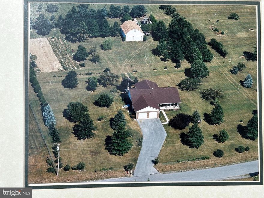 Nestled in the serene community of Gerrard Acres, this charming ranch-style home offers a perfect blend of comfort and functionality. This well-maintained residence boasts a solid brick exterior and an inviting atmosphere that makes it feel like home from the moment you drive up. With three spacious bedrooms and two full bathrooms and an open floorplan this home is designed to accommodate your lifestyle needs. The heart of the home features a well-appointed kitchen equipped with stainless steel appliances, including a built-in microwave, dishwasher, side by side refrigerator and electric oven/range. The living spaces are enhanced by gleaming hardwood floors and newly istalled carpet, providing warmth and versatility throughout. Natural light pours in, creating a bright and airy ambiance that invites relaxation. The unfinished full basement offers work benches and unlimited storage.Step outside to discover the expansive 2.5-acre lot, where nature meets tranquility. The beautifully landscaped lot offers a peaceful retreat among mature trees and plantings. Enjoy the stunning mountain views that provide a picturesque backdrop for your outdoor activities. The property features ample space, perfect for gardening or simply enjoying the fresh air. For those who appreciate convenience, the home includes both an attached and a detached two car garages, providing plenty of space for vehicles and additional storage. The oversized detached garage with walk up attic storage ensures that you have room for all your tools and toys, making it easy to maintain your outdoor oasis. Relax on the inviting porches, where you can sip your morning coffee while taking in the serene surroundings. This home is not just a place to live; it's a sanctuary where you can create lasting memories. With its excellent condition and thoughtful features, this property is ready to welcome you home. Experience the perfect blend of comfort, space, and natural beauty in this delightful residence. Don’t miss the opportunity to make this your own!