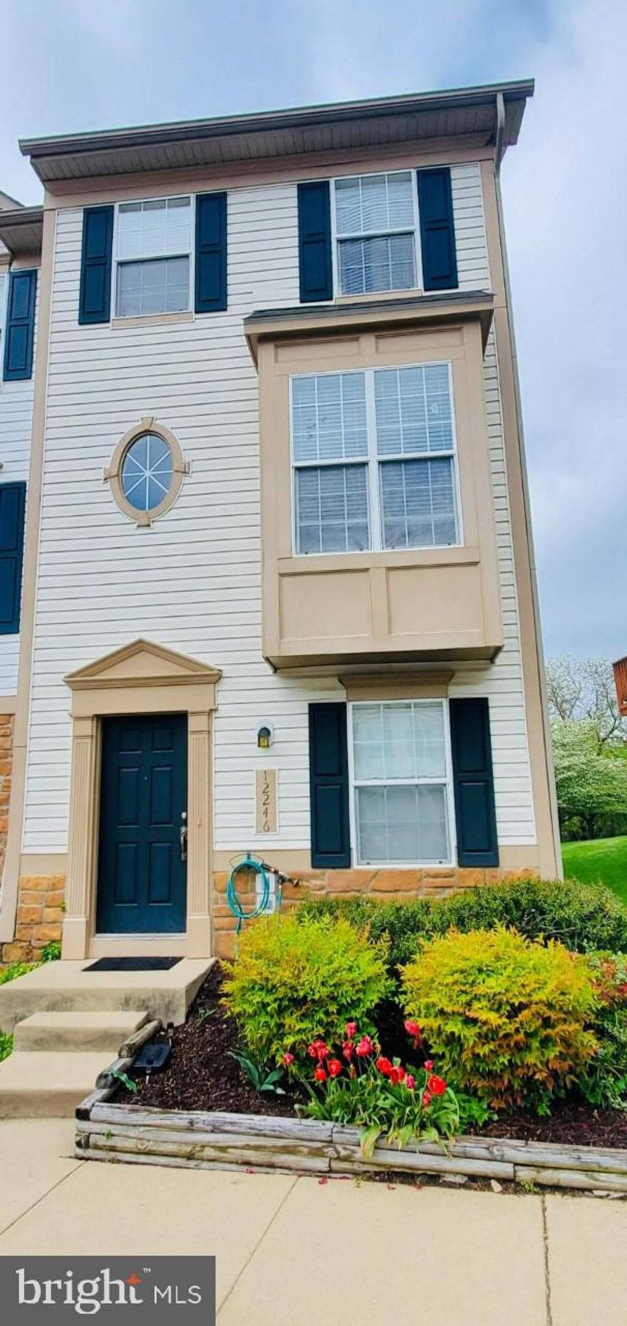 WELCOME HOME! A wonderful well maintained 3 level end-unit townhouse with lots of natural light backing to trees in the heart of Lake Ridge. Open concept with 3 bedrooms and 3 full baths. The first level features one bedroom, a full bathroom and a rec room with access to a patio backing to trees. The second level features hardwood floors throughout the living room/dining room area, a large eat in kitchen with an island, granite counter tops and a spacious deck for entertaining or grilling. The third level offers two spacious master bedrooms with their own private bathrooms. Two assigned parking spaces located in front with ample guest parking on a No Thru Street. 2019 new A/C, roof and furnace. 2018 new kitchen appliances and washer/dryer. 2015 water heater. Kitchen and bathrooms remodeled in 2018. Walking distance to shopping center, Lake Ridge Park and Marina, and golf. Homeowner dues include water, trash, lawn care, snow removal, outdoor pool, tennis court and playgrounds. Come see it before it's gone! By appointment only.