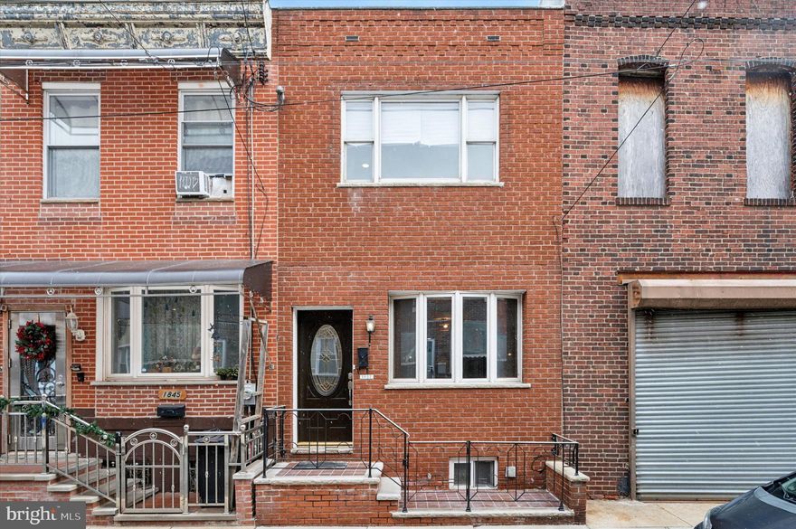 Check out this renovated 2-bedroom, 2-full bath brick front home with 1800+ sq ft of living space in prime Newbold location! This contemporary home features an open living/dining room floor plan with new hardwood floors throughout, LED recessed lighting, custom iron railings, central air, and front bay windows that let in tons of natural sunlight. The large, modern kitchen is perfect for entertaining, with an oversized island offering seating for 4, 42” flat panel cabinets, tiger skin granite countertops, and stainless steel appliances. The main floor includes a beautiful full bath with a walk-in shower, designer tiles, and  new vanity. Upstairs, the spacious primary bedroom includes a custom walk-in closet system, and the second bedroom has a custom reach-in closet with built-ins. Step outside to the oversized private deck with amazing views of the Center City skyline! The modern hall bath is a true standout, with a huge soaker tub, separate walk-in shower, and designer dual vanity. The finished lower level adds even more living/entertaining space, complete with tons of built-ins. Located on a tree-lined block just steps from 2nd District Brewery, South Philadelphia Taproom, Ultimo Coffee, The Newbold Exchange, and Miss Rachel's Pantry, and only two blocks to Broad Street and major public transportation. With a WalkScore of 98, this home is truly a walker’s paradise!