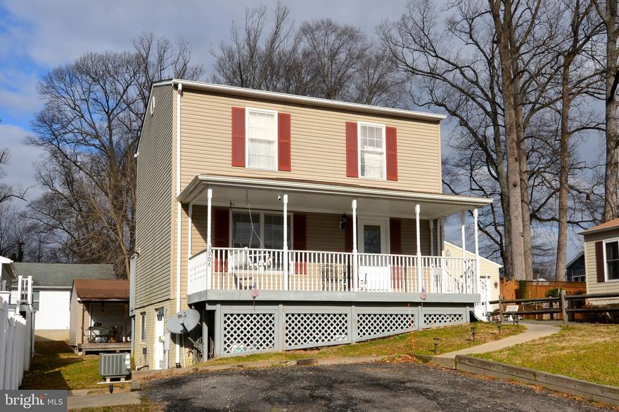3 level Colonial style home with front porch and large rear deck is just 5 blocks from the Chesapeake Bay.  The home is divided into 2 living areas.  The upper unit which is the main level and upper level of home features 3BR, 2.5FB, full kitchen, dining room, living room and laundry area.  The lower level of the home features a 1BR 1FB, full kitchen with breakfast bar, living room and laundry area in-law apartment with private walk-out level entrance.   There is also an outbuilding  with power at the rear of the property.  The home is currently tenant occupied with limitations in showing access.  The property is currently professionally managed by Property Management of Southern Maryland.   Property shows well, but being sold as-is.