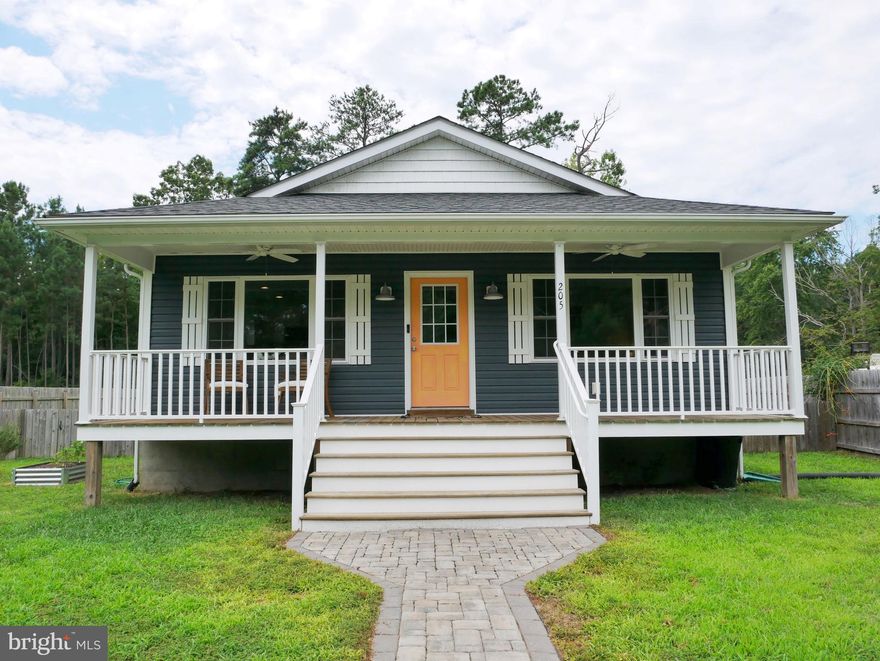 Come home to this beautiful property in the sought after Westmoreland Shores development just outside of the town of Colonial Beach.   The neighborhood has very little purchase inventory lately so don’t miss out!    This 5 year young house built by popular custom home builder Jett III offers 3-bedroom 2-bath and awaits its new owners to enjoy.    Standing on a tranquil, low-traffic street, the home is only a short distance to the oasis of nature that is Potomac River.   The Westmoreland Shores community has access to a lovely community sand beach, community center, boat ramp and pier.  The proximity to concentrations of employment (Naval Surface Warfare Center Dahlgren) makes for a short commute.
Rear fencing heightens the sense of privacy in the backyard that backs to trees.   Representing the welcoming personality of the home, a spacious front-facing porch complete with ceiling fans is a nice spot for relaxing with your favorite morning coffee or afternoon refreshment.     Your outdoor furniture will transform the rear stone patio into an extension of the home, and the sky into your blue or starry ceiling.  The fire pit is perfect for roasting marshmallows with friends.  You can access this patio directly from your master bedroom or the convenient side entry door through the convenient utility room.  
Within, the residence is rich with remarkable plusses. The atmosphere is suffused with an abundance of stylish lighting.   The electric fireplace will be the heartbeat of many living room gatherings, or serve as the centerpiece for a few minutes of solitary tranquility. The kitchen is a well-presented dish of inspiring granite counter space with tile backsplash and major stainless appliances. A classic island configuration maximizes workspace and flexibility.  For sanctuary from the day, the master bedroom cannot be beat as it provides that direct access through walkout slider door to the stone patio with fire pit.  You can sneak out for that private evening.      The other 2 unique bedrooms offer the convenience of ground floor accessibility
Open the front door to a pleasant new life here in the Colonial Beach area.    This property is great for year round living or weekend getaway.    Bring your boat and water toys.   Bring your golf cart too!  Westmoreland Shores is a golf cart community where you can hop on your cart for a short ride to the community sand beach along the Potomac River.   If you want restaurants, shops and marinas you’re just a short few minutes from the town of Colonial Beach.    Don’t forget though, that living in Westmoreland Shores you avoid the double taxation that living the town would require.