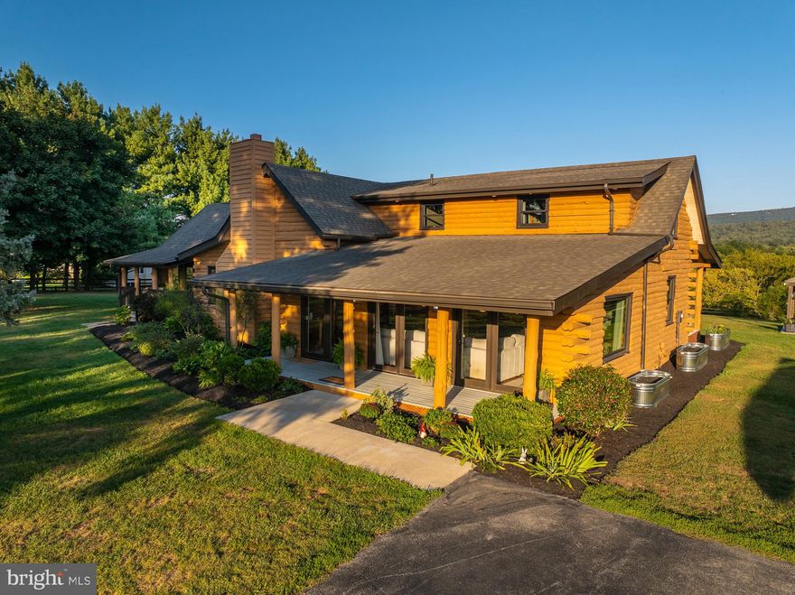 Stunning Riverfront Retreat on 4.96 Unrestricted Acres!

Welcome to this one-of-a-kind, contemporary log cabin-style home nestled along 200+ ft of pristine Shenandoah River frontage and private fishing pond. This 4 bed, 3.5 bath home offers nearly 5 acres of unrestricted land—ideal for those seeking privacy, space, and waterfront living with sweeping views of the Blue Ridge!  Amazing fishing, deer, bald eagles.  Park like setting.  HUGE first floor in-law suite!

Enjoy the beauty of the outdoors from two covered front porches and a covered rear porch, all freshly painted. The level, paved driveway offers plenty of parking, including space near the workshop/storage shed. New exterior lighting adds a modern touch.

Inside, you'll find a spacious living room with hardwood floors and dramatic floor-to-ceiling windows. The bright dining room flows into the kitchen, featuring yellow pine flooring, white cabinetry, granite countertops  and a large island with breakfast bar seating.  NEW Anderson Windows.

The open-concept family room is perfect for entertaining, with soaring cathedral ceilings, exposed beams, and a striking stone fireplace. The south wing includes Bedroom 1 with a private full bath, a laundry/utility room with sink, and a half bath.

On the north wing, the luxurious main-level primary suite offers its own private entrance, a sitting room, a kitchenette with granite counters, and a spa-like en suite bath featuring a porcelain tile shower and custom vanity.

Upstairs, a large loft overlooks the family room and provides flexible living space. Bedroom 3 offers cathedral ceilings and a ceiling fan, while Bedroom 4 is a two-room suite—ideal for a bedroom plus office/sitting area—with separate HVAC for comfort year-round.

Additional features include:
• Pre-wired for whole house generator
• Geo-Tek horse fencing
• Gorgeous wooded trail leading to the river

This is a truly rare opportunity to own a riverfront escape with space to breathe and entertain. Whether you're fishing, kayaking, or just relaxing on the porch—this home is a dream come true.

Schedule your private tour today—and don’t forget your fishing pole!