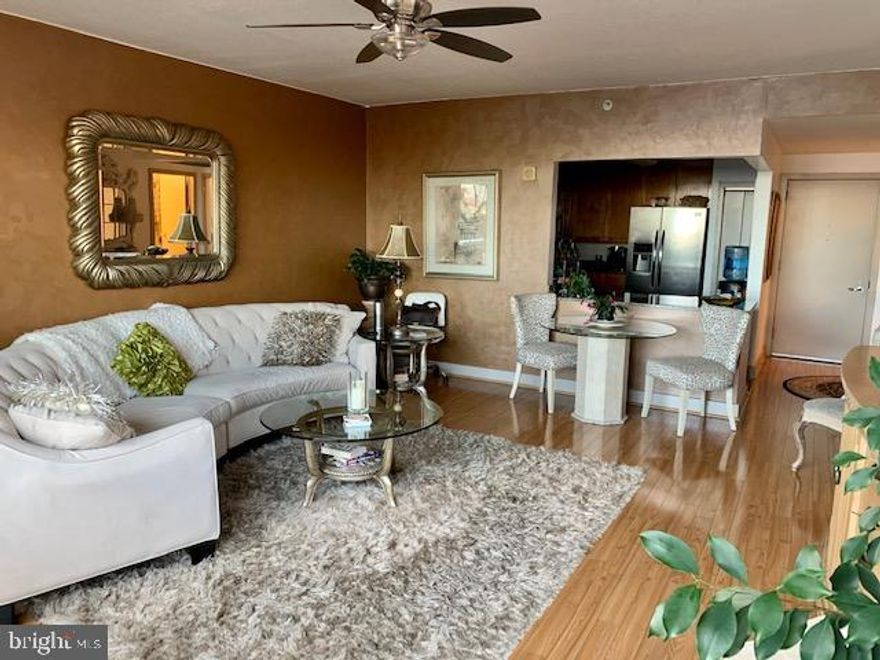 Absolutely gorgeous large waterfront one bedroom unit with 1000 sq ft terrace in the beautiful Dockside condo. This is a spacious unit with lots of natural lighting from huge windows and terrace. Extraordinary views of the city, water and bridge. Great size kitchen with large breakfast bar, and all appliances. A large size bath, full-sized stacked washer and dryer and a huge walking closet. Lots of amenities and conveniences with this condo building, gated indoor parking space, one reserved parking space, 24 concierge, fitness facility, heated indoor swimming pool and hot tub, spacious community/entertainment room with party kitchen, big screen tv, surround sound system, pool table and an enormous terrace with awesome views of the river. Short commute to Queen Village, Old city and Penns Landing. Easy access to 95 north and south. Available private mini bus to take residents to Center City points. Living on the 4th floor has an added feature of being next door to the community room which is never busy and basically extends your living space for guest entertainment also across the hall from the pool area just superb accommodations.