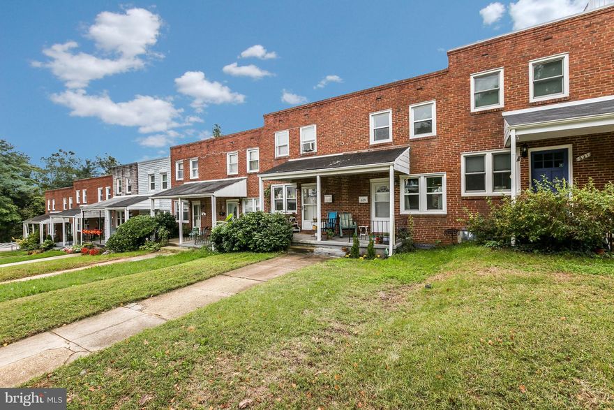The best of all possible worlds! Just steps from Hampden's Avenue, a short walk to the Rotunda and a stone's throw from Wyman Park is 619 West 36th Street.  This tastefully renovated 1950's porch-front rowhome features two sizable bedrooms and 1 full bath.  Recent updates include new windows throughout, new kitchen appliances, new tile flooring and back splash in the kitchen. The bathroom features new tile and upgraded lighting and storage.  The partially finished basement would be ideal for an office, tv space, or guest area.  The unfinished portion of the basement houses a washer and dryer and plenty of storage.  The spacious, low-maintenance back yard is great for entertaining and has the potential to be converted into a parking pad.