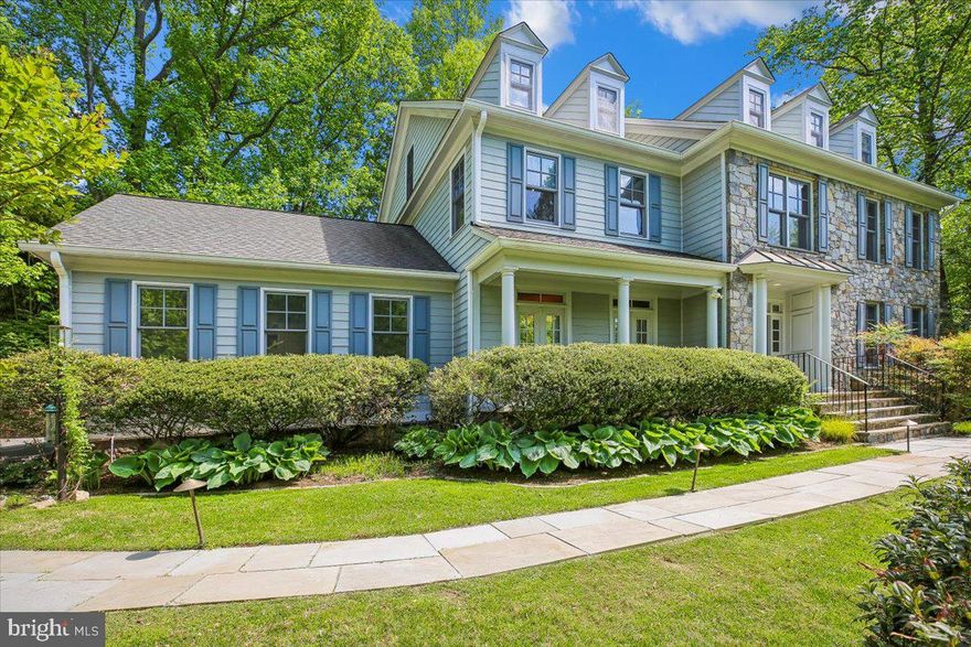 Welcome to livable luxury in Bethesda’s sought-after Glen Echo Heights, where timeless style meets modern comfort. Privately set at the end of a pipe stem driveway, this exceptional 6,550-square-foot Colonial offers 7 bedrooms and 5.5 baths, showcasing a striking stone façade, beautifully landscaped grounds, and an attractive slate walkway that leads to an inviting front entry. Inside, a grand foyer with a sweeping open staircase sets the tone, complemented by rich hardwood flooring and fresh, neutral paint throughout. Designed for both everyday living and elegant entertaining, the formal living room flows seamlessly into a sun-drenched solarium with expansive windows, while the gracious dining room, accented by French doors, opens to the outdoors, creating a bright and elegant setting for entertaining. At the heart of the home, the renovated gourmet eat-in kitchen, featuring white cabinetry, quartz countertops, an oversized center island, and premium appliances including a Wolf cooktop, Sub-Zero refrigerator, and GE Monogram wall ovens and dishwasher. A thoughtfully designed spacious breakfast area with built-ins, desk space, wine rack, and wine refrigerator opens to the inviting family room, where custom cabinetry and a marble-surround gas fireplace create a warm and welcoming space. A mudroom and powder room add convenience, completing the main level. Upstairs, the luxurious primary suite offers a serene retreat with a beautifully renovated spa-inspired bath, complete with dual vanities with special in-mirror lighting, a soaking tub, and a rain shower, along with two walk-in closets. Three additional bedrooms, including a Jack and Jill bath, a full hall bath, and a dedicated laundry room complete the second level. The third floor provides incredible flexibility with two spacious bedrooms, a full bath, and a bonus area ideal for a home office, studio, or playroom. The fully finished, walk out lower level is designed for entertaining and relaxation, featuring a large recreation room with marble-surround gas fireplace, game area with pool table as well as a  bedroom and full bath—perfect for guests, an au pair, or extended family. An unfinished bonus room space offers endless potential for a home theater or wine cellar. Step outside to your own private oasis, where a slate patio and trex deck span the rear of the home and perfect for dining al fresco or hosting gathering and overlooking a beautifully landscaped backyard terrace. Completing this exceptional home is a two-car garage equipped with a Tesla charger, blending luxury with modern convenience.  Perfectly situated for both convenience and lifestyle, this exceptional home is just moments from an array of shopping and dining, including the newly developed Westbard Shopping Center and vibrant downtown Bethesda. Ideally located approximately two miles from the DC line, it offers easy access to the city while enjoying the charm of this Glen Echo Heights neighborhood. Enjoy minutes to rare direct access to the C&O Canal towpath along the Potomac River, as well as nearby community amenities including a pool and playground. All of this is complemented by its location within the highly desirable Walt Whitman school district. This is a rare opportunity to own a truly special home in one of Bethesda’s most desirable neighborhoods.