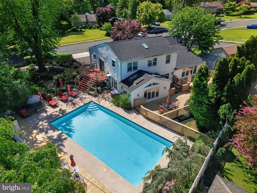 Welcome to 821 Beverly Road. This property is an absolute treasure. Lovingly maintained and meticulously updated with modern features, this home captures a perfect balance of a sprawling estate mixed with the warmth of a humble Rydal split level. The house features a two car garage with access to the lower level laundry, mud room and utility room. On the main level you enter into a cozy yet expansive living room with vaulted ceilings, automatic remote controlled blinds and a working fireplace (with new liner). French doors lead to a dining room (with gas fireplace) and a sizable kitchen with modern amenities and classic finishes.  In the rear of the home, a massive great room, with vaulted skylights, overlooks the bright and sunny, heated salt water pool. Slider doors open to several deck areas, perfect for outdoor dining and private conversations, away from the pool activity. The main bedroom also features a sliding door access to a deck leading directly to the pool patio. For a further retreat, the pool area cascades down into a multi-tier coy pond with a winding stone walking path. This path leads to a shady patio, destined to be your weekend afternoon refuge, accompanied by the gentle rhythmic flow of your own private babbling brook. Bonus features: Brand new roof (2025), regular maintenance on heating and AC units, "Generac Power Systems" whole house generator for emergency power (natural gas), new pool filter system (2024), transferable pool maintenance contract paid thru the season (covers regular cleaning and pool closing at end of summer 2026), coy pond maintenance contract paid thru summer (includes cleaning and closing of coy pond at the end of this season). This house is buttoned up and move-in ready; a gorgeous neighborhood, a huge corner lot and a home with so many possibilities for a bright future in Rydal PA.