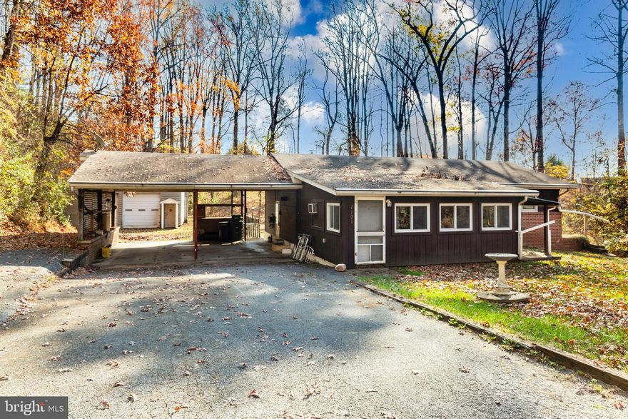 Welcome to 7121 Brangles Rd, Marriottsville, MD—a property brimming with potential and teeming with possibilities. Unleash your imagination on this versatile home, perfectly poised for custom updates to make it your own.

This unique residence is ingeniously designed with two distinct living areas, each with its own private entrance. The main level offers a cozy abode with 2 bedrooms and 1 full bathroom, a fully functional kitchen, and a comfortable living area, all awaiting your personal touch. 

Venture to the lower level, where you'll find an additional 2 bedrooms and 1 full bathroom, coupled with another kitchen and laundry area. The interior stairs have been sealed, presenting the option to maintain separate living quarters or to reintegrate them into a single-family home.

Car enthusiasts will revel in the expansive 54' x 29' two-bay garage with soaring ceilings, ideal for a fleet of vehicles, a grand workshop, or storing equipment, hobbies, and toys. It's a haven for creating, fixing, and showcasing your automotive passions.

Nestled in a prime commuter location, this property offers the best of both worlds—serene suburban living with easy access to main thoroughfares. Whether you're seeking a multigenerational home, an investor's dream, or a canvas for your dream residence, 7121 Brangles Rd holds the key to a multitude of opportunities.