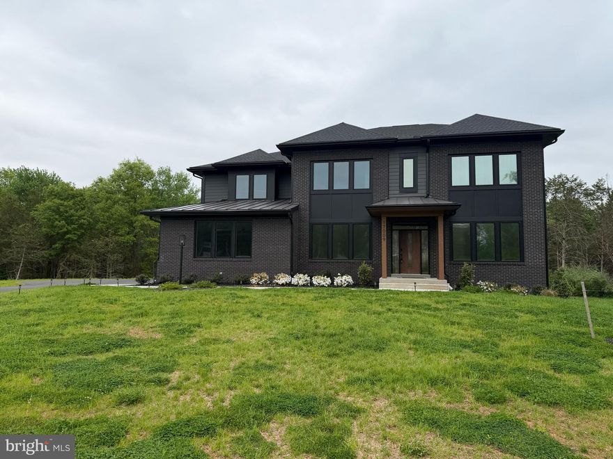 Exceptional Light-Filled Estate on 2.5+ Private Acres in Poolesville — No HOA! Welcome to this stunning turn-key, move-in ready home nestled on over 2 private acres backing to woods and conservation land, offering the perfect blend of luxury, privacy, and modern convenience. With room for a custom pool (already permitted) and a generous backyard ready for your vision, this property offers resort-style living at home. Designed with a custom elevation and filled with thoughtful upgrades throughout, this light-filled home showcases expansive windows, sun-drenched living spaces, and an open floor plan ideal for both everyday living and entertaining. From the moment you enter, you’ll appreciate the wide-plank hardwood floors, spacious layout, and quality craftsmanship, with too many upgrades to list. 
The heart of the home is the gourmet kitchen, featuring quartz countertops, stainless steel appliances, extra-wide 42” refrigerator, oversized walk-in pantry, breakfast bar, sunroom, and lanai, creating a seamless flow for gathering and entertaining. A kitchen sink water filtration system adds an extra touch of convenience. The main level also features a bright private office with a custom mural, plus a flexible bonus room that can serve as a main-level bedroom or additional living space.
The oversized mudroom leads to an attached 3-car garage plus additional 4th garage bay, complete with an electric vehicle charging station, offering incredible functionality and storage.
Upstairs, the luxurious owner’s suite is a true retreat with his and hers walk-in closets, a spacious spa-inspired ensuite, private sitting area perfect for a study, TV room, or yoga studio, and a private lanai to enjoy morning coffee with peaceful views. Four additional generously sized bedrooms and three full baths provide abundant space for family and guests. The fully finished walk-up lower level expands your living and entertaining options with 2 additional bedrooms, full bath, gym/theater room, large recreation room, and a wet bar with refrigerator and dishwasher hookups. Perfect for remote work and modern living, enjoy ultra high-speed FiOS and an unbeatable location just minutes to three MARC train stations, with easy access to Rockville, Gaithersburg, Washington DC, Leesburg, and Frederick. Located in the heart of charming Poolesville, known as one of Maryland’s best small towns and home to the award-winning Poolesville High School cluster, this exceptional property offers the rare freedom of NO HOA along with space, privacy, and community.
Light-filled, beautifully upgraded, and designed for both luxury and lifestyle—this extraordinary home truly has it all.