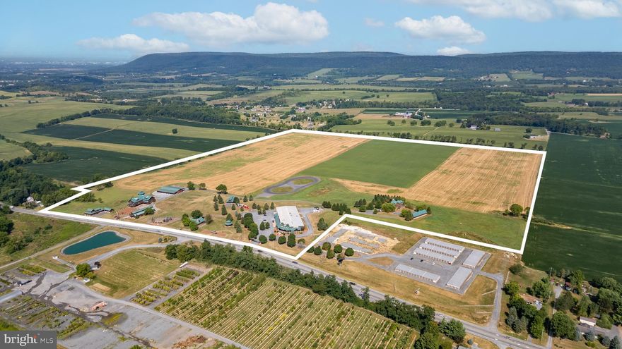 This incredible property offers diverse business, commercial, and industrial opportunities. Spread over 146 acres with an impressive 1,600 feet of frontage on Route 322, this location is a true powerhouse for visibility and growth. For over 25 years, this location has been home to a successful business and iconic showroom. The 11,000-square-foot state-of-the-art showroom features a loft area, multiple offices, storage spaces and reception area. Just beyond that is 16,000 square feet of service bays, support areas, inventory storage, and loading docks. This setup is ideal for large-scale business operations. In addition, there are multiple residential income-producing units, a massive event barn, fully equipped, painting and mechanic shops, as well as a primary residence, multiple garages and additional outbuildings. There are over 90 acres of prime agricultural land ready for a vision. Whether to expand on the existing infrastructure, create a new complex, or develop a multi-use hub, the possibilities are endless. This is more than just real estate—it’s an opportunity for innovation, expansion, and investment in one of the most strategic locations in Pennsylvania. With its unique zoning classification, this property allows for many principal and conditional uses. This property occupies a prime logistical location at the heart of Pennsylvania, with direct connections from Route 322 to Interstates 80 and 99—key arteries for coast-to-coast and regional trade. Its central position in the state places it at the nexus of rail lines and roadways, perfectly suited for distribution, logistics, or national operations. Close to University Park Airport and the Harrisburg International Airport, and within a few hours’ drive to other major airports such as Philadelphia, Newark, JFK and Baltimore, to name a few.