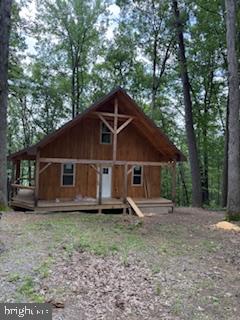 No Showing Until August 11.Prime location with easy access to outdoor recreation, plus panoramic views just a short drive down the road. Hunting, fishing, boating, rafting, hiking are all within a short distance. A delightful Mcveytown find, this brand new Post and Beam/Hemlock Board and Batten cabin was constructed with lots of quality by impeccable builders. It features a soaring ceiling in the great room with a huge loft overlooking the open floor plan. There is a first-floor bedroom and full bath as well as the loft area for another bedroom, and also has been equipped with a with a split heating and cooling system awaiting for it's new owners and utilities are up to date with on-site septic, private well and electricity. Conveniently located a short drive to the the fun of Lake Raystown, Greenwood State Park and the Juniata River. The front porch is a nice spot for relaxing with refreshments, whether morning coffee or twilight nightcap. The setting is very tranquil within the mountains and forests. Don't let this be the one that got away.