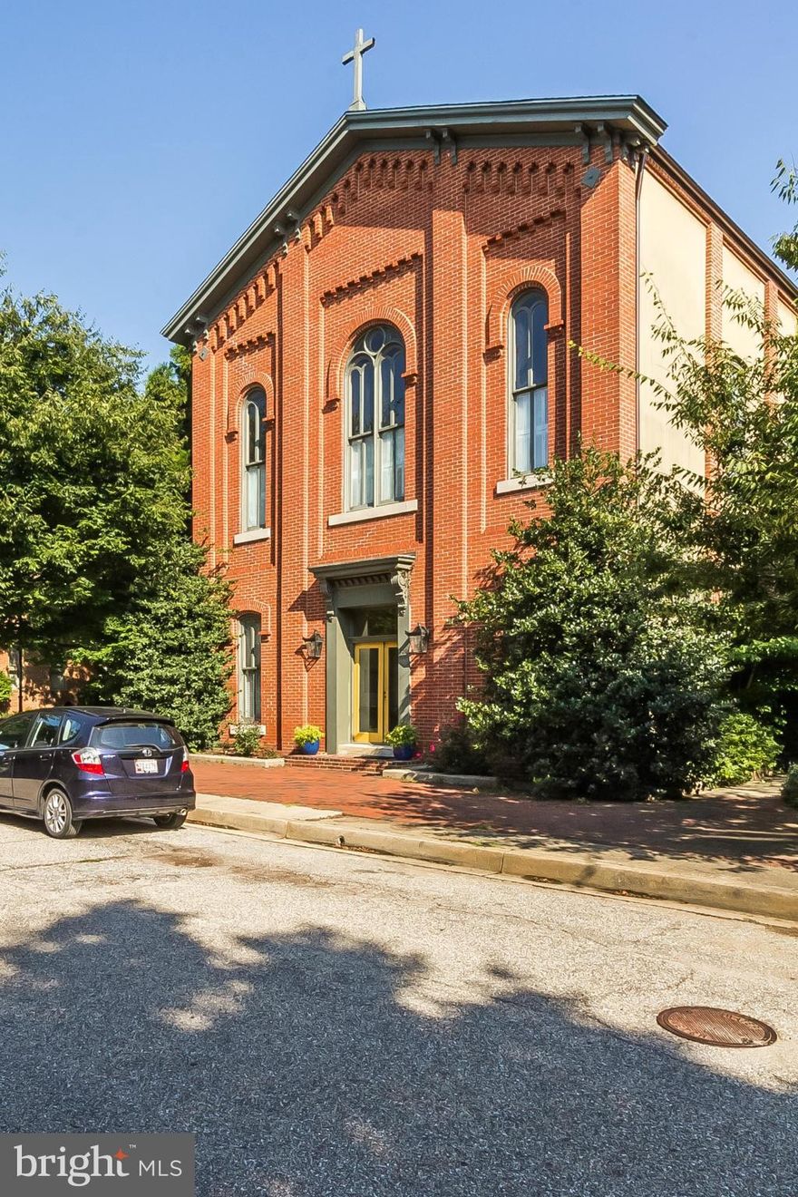 The soaring ceilings and huge windows of this converted Church make you feel like you are living in the trees over Otterbein's beautiful Concert Park.  One of only 4 units, this multi-level condo features exposed brick, hardwood floors, neutral decor and a large open layout.  The LR feat a 2-side fireplace.  2BR, 2.5 baths w/ additional office/den areas. Views from 3 sides.  One of a kind!