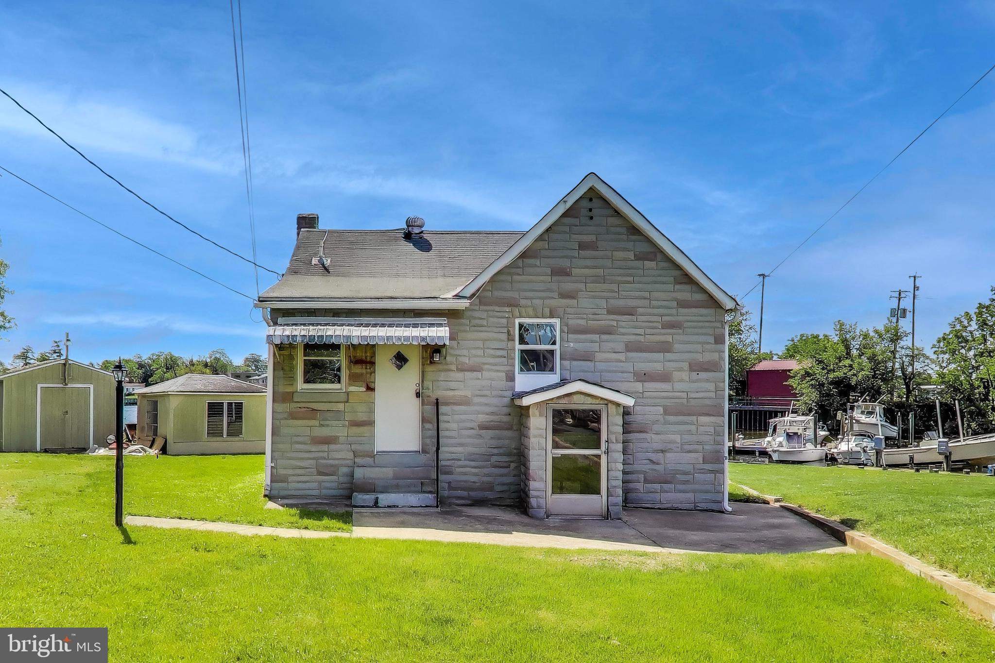 Waterfront living. This enchanting 2-bedroom home invites you to experience a perfect blend of bayfront tranquility and city access. 3D tour at: https://real.vision/my/8349-bear-creek-drive/tour . As you step inside, you'll be greeted by a fully renovated home that radiates warmth and coziness, making it the ideal retreat after a busy day. The full bathroom is designed for relaxation, offering a serene space to unwind and rejuvenate. This home is a canvas ready for your personal touch, ensuring every moment spent here is as unique as you are. Nestled in a prime location, this property offers easy access to the vibrant heart of Baltimore, where entertainment, dining, and culture await. Whether you’re planning a quiet evening in or an adventure out, this home provides the perfect starting point. Discover the joy of living in a community that offers both convenience and a sense of belonging. Desired tenant salary is three times rent. All PMI Potomac residents are enrolled for an additional cost ($29.95/mo) in the Resident Benefits Package (RBP) which includes HVAC air filter delivery, and a utility concierge service making utility connection a breeze during your move-in, our best-in-class resident rewards program, and more! This property is non-smoking, pets allowed.