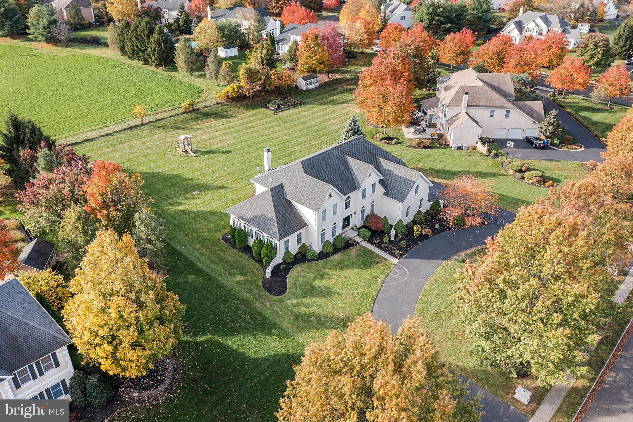 Welcome to 1791 Jockeys Way… a beautiful grand 4-bedroom home in Bridle Estates on a quiet street backing up to 40 acres of preserved farmland. Entering the double front doors, you'll see the foyer with the dramatic center staircase that leads to an open 2nd floor catwalk overlooking the 2nd story. The foyer is flanked by the formal living and dining rooms, featuring beautiful wainscotting, custom crown molding on the 10' high ceilings, neutral paint and 7” wide plank hardwood floors throughout. Family room with newer modern floor to ceiling stack stone wood burning fireplace. Soaring cathedral ceiling with skylights fill the room with natural sunlight. Formal dining room open to the incredible newer gourmet kitchen with breakfast area and french door out to the large composite deck. The features beautiful white cabinetry, a huge island with thick waterfall Quartz countertop. Stainless steel gas range, oven, microwave drawer, refrigerator, wine/beverage refrigerator pantry and new lighting. The huge Conservatory with tray ceiling and walls of windows offers a lot of flexibility as an additional entertaining space, billiard room, sunroom, playroom, or future first floor guest suite… the options are endless. From the Conservatory, you have French doors leading to both the formal living room and the private study. The spacious powder room, laundry room/mudroom with access to the 3 car garage complete the main level. The secondary staircase from the kitchen provides easy access to the 2nd level. Upstairs you’ll find 4 generously sized bedrooms, with new carpeting and 3 full bathrooms. The Primary Bedroom features a sitting room, large walk in closet and spacious bathroom with soaking tub and glass paned shower and duel vanities with cathedral ceiling and skylights. Bedrooms 2 and 3 share a large jack and jill bathroom with double vanity. Bedroom 4 has an en suite full bathroom. All bedrooms have large windows, new carpeting and plenty of closet space. This home also features a full unfinished basement with extra ceiling height, NEWER roof with architectural shingles, NEWER water heater, NEWER floors, NEWER carpeting, NEWER paint, NEWER gourmet kitchen, NEWER lighting. Beautifully remodeled home with indoor outdoor living on 1 acre, surrounded by preserved farmland makes the perfect oasis. Horseshoe driveway for tons of parking and convenience. This home also is conveniently located with easy access to the train station and 95 for commuting to both Center City Philadelphia and NY/NJ. Minutes from both downtown Yardley Boro and Newtown Boro. The Makefields Highland Golf course is located nearby, as well as the Delaware Canal and Towpath. Don't miss this amazing home that is ready for you to move in and enjoy!
