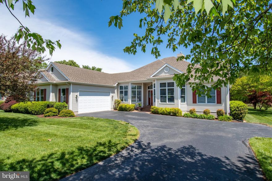 One of the most popular and sought after model homes ever to be built at The Easton Club.  From the moment you enter the foyer with its high ceiling and gleaming wood floors, you will be captivated by the bright and open feel of this home.  This geothermal home features an upgraded gourmet kitchen complete with granite countertops, under cabinet lighting and island with gas cooktop.  Just off the kitchen is an open dining area and family room with gas fireplace, custom built-ins and a beautiful tray ceiling.  Beyond the dining area is a bright and cheery octagonal sunroom that opens to a lovely screened porch, where one can appreciate stunning and expansive views of the pond, trees & wildlife.  First floor primary suite features a sitting area and opens to the rear deck and screened porch.  Two additional bedrooms, a full bath & half bath, office and laundry room finish out the first floor.  The climate controlled second floor adds 1,500 sq ft to the home and includes a recreation/hobby room, office area, bonus room and ample storage.  There are skylights, a half bath and a cedar lined closet along with mulitple custom built cabinets.  The entire area offers a great opportunity to make it what you wish.  The 2-car attached garage is fully finshed with painted floors, 10' bump out and storage room.  Tankless water heater, security system, central vac system, intercom system, stainless steel appliances, 2 ton Mr. Slim heating & air in the garage & 2nd floor are just a few of the many upgrades & amenities.