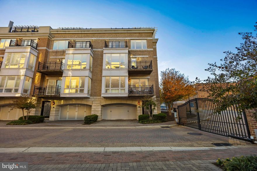 Rare opportunity at a newly improved price to own a premier waterfront residence in one of Baltimores most coveted gated communities along the iconic Inner Harbor. Discover an extraordinary end-of-group Pier Home offering breathtaking panoramic harbor and skyline views from every room. Perfectly positioned within the prestigious gated community of The Pier Homes at HarborView, this five-level residence captures stunning water views while delivering the ultimate blend of luxury, privacy, and city convenience. Designed for refined living and effortless entertaining, the home spans over 2,900 square feet and features three bedrooms plus a den, two full baths, one half bath, three verandas, a rooftop terrace, and a two-car garage with parking for up to four vehicles. The thoughtfully designed floor plan showcases 10-foot ceilings, oak hardwood floors throughout, and multiple indoor-outdoor living areas ideal for both entertaining and everyday comfort. The main level offers an expansive open-concept living and dining area with a gas fireplace, custom built-ins, powder room, and a chef’s kitchen appointed with gas cooking, stainless steel appliances, granite countertops, ample cabinetry, and a breakfast area. The third level presents a spacious primary suite complete with two custom walk-in closets, a private balcony overlooking the harbor, and a spa-inspired bath featuring a soaking tub, double vanity, and glass-enclosed shower. The laundry room is conveniently located on the bedroom level, while the fourth floor offers two additional bedrooms, a full bath, and a flexible family room or home office with stunning water views. Recent upgrades further elevate the home’s appeal, including an epoxied two-car garage floor, new 75-gallon hot water heater with expansion tank, updated lighting, new window treatments throughout, new washer and dryer, custom built-in closets and laundry room, and integrated smart home features. Enjoy unparalleled harbor views from every leve whether relaxing by the fireplace, dining al fresco on the veranda, or entertaining on the private rooftop terrace. The Pier Homes at HarborView deliver the ultimate balance of luxury, waterfront serenity, and downtown convenience. Community amenities include 24/7 security with attended gate entry, concierge, fitness center, outdoor pool access, marina, private trash and snow removal, and beautifully landscaped grounds—all just steps from the Inner Harbor Promenade, Federal Hill Park, top restaurants, shopping, and easy access to I-95.