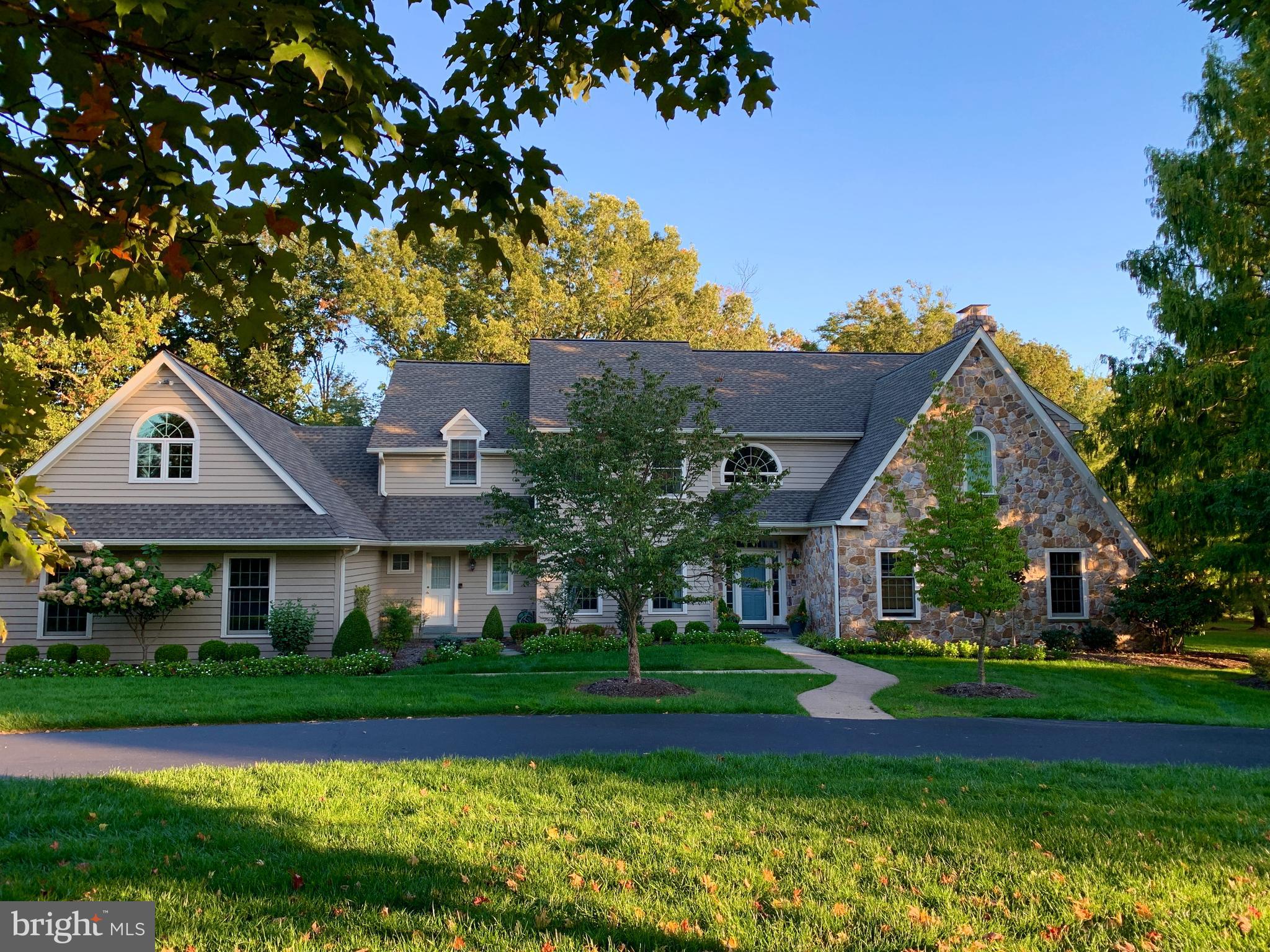 Welcome to this beautiful 2-story Guidi-built Colonial style home, designed by the renowned architect, Ann Capron. Once you turn onto Hobby Horse Hill, you will notice this home sits on a quiet cul-de-sac and is very private. The 1.01 acre lot offers mature trees and is professionally landscaped. With pride of ownership, this 5-bedroom, 4.3 bath, 3-car garage home shows like a model. Walk up the curved walk-way to the beautiful front door entryway into the 2-story custom painted foyer with a large palladium window that adds plenty of light and a large hardwood staircase. You will immediately notice the special touches this home offers; hardwood flooring thru out, beautiful curved staircase, custom millwork and 9+ ft ceilings. To the left is the formal dining room featuring chair rail, custom paint, and 2 large windows, great for entertaining and holiday gatherings. To the right is the formal living room with 4 beautiful windows and a beautiful gas fireplace with granite hearth. Off the living room you will find a large screened-in porch with flag-stone flooring and ceiling fan. Plus, a large Trex deck with aluminum rails, all for you to enjoy the warm summer nights. Just beyond this room is the large family room with vaulted ceiling, 2 skylights, recessed lighting, beautiful floor to ceiling wood burning fireplace, with stone hearth & surround, perfect to cozy up during those cold winter nights. The magazine-worthy custom kitchen, designed by Merrie Fredericks, is right next door. It features a large island, an abundance of cabinets, top of the line appliances and a hidden walk in pantry. It offers 42in French White glazed wood, soft close, cabinetry with detailed craftsmanship, granite counters, high-end Wolf, 6 burner gas range, built-in double oven, Sub Zero built-in refrigerator, Sub Zero additional refrigeration and freezer drawers, and newer dishwasher. A large window over the kitchen sink with custom curtains provides plenty of natural light and a beautiful view of the scenic back yard and beyond. Off the kitchen, through the double glass sliders you will find an expanded stone paver patio overlooking the serene manicured yard with large shade trees. There is an office/study on the first floor with hardwood flooring, double windows, surround sound and custom built-in cabinetry. For your convenience the laundry room is on the first level with new cabinetry, sink and nearby closet for storage. Also, there are 2 newly finished half baths on the first level. On the second level the large bright and cheery master bedroom with sitting room, 3 walk-in closets/dressing area and the new adjoining bath offers a tiled stall shower, dual granite vanity, free standing soaking tub and radiant heat tile floor. To finish off the second floor there are 3 additional bedrooms, 1 with en-suite, 2 with adjoining jack and jill bath. All with large walk-in closets. Plus, over the garage, a finished in-law/au pair/office suite with its own back stairway for access, full bath and much more. The full finished basement is ready for billiards, ping pong, exercise and entertaining, with newer neutral carpet recessed lighting and plenty of room for storage. This home offers a newer roof, newer Pella windows, newer triple zone Trane HVAC units and irrigation system covering the front and sides of the property. This home is in the highly sought-after Polo Club Estates. Situated near Springhouse Village with Whole Foods, downtown Ambler with dining and theater, Shopping Malls (Montgomery, Plymouth Meeting, King of Prussia) and plenty of restaurants for you to enjoy, community college, libraries, hospitals and YMCA. Less than an hour from downtown Philadelphia and the airport with very convenient access through Regional Rail and Septa. To top it all off, this home is in the award winning, most sought after Wissahickon School District.