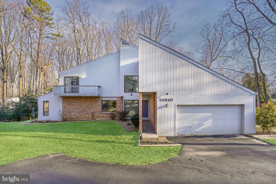 Stunning picturesque mid century modern 4 bedroom and 2.5 bathroom contemporary home with 2 car garage on a 1 acre wooded lot! Main level features open floor plan with hardwood floors throughout and plenty of natural light. Gourmet kitchen with granite countertops, stainless steel appliances and maple cabinets, which opens to sun-drenched breakfast room with skylight and access to deck. Spacious family room with gorgeous views of the backyard and deck access, with wood stove fireplace.  Upper level features primary bedroom with vaulted ceiling and ensuite bath and walk in closet. There are additional 3 bedrooms, full bath, and laundry room to complete the upper level. Bonus room great for a gym, playroom or study.  Large fenced-in side yard with patio, garden, and storage shed. Updated 2017: HW floors, windows, roof, Hardiplank siding, kitchen, appliances, heater. Water pressure tank replaced in 2020. Great location, nearby Fox Mill Rd, West Ox Rd and Oakton school district! Offers due  Monday 2/21/2022 5PM EST. Sellers reserve the right to accept offers before deadline.  Seller needs 60 day rent back.