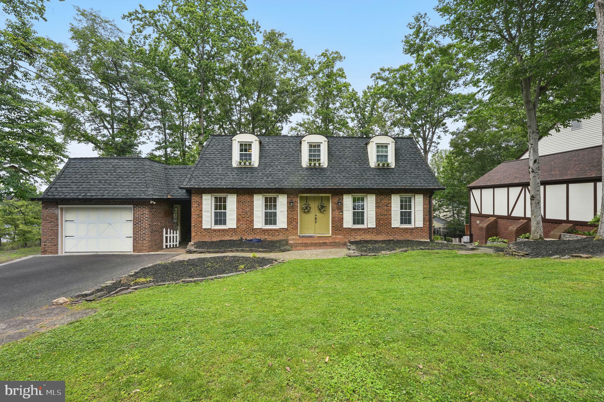 Welcome to this one-of-a-kind Colonial nestled on a picturesque street in the highly desirable Montclair community—where charm, character, and space come together in perfect harmony. Blending contemporary flair with classic colonial lines, this home offers three fully finished levels of beautifully designed living space and a yard built for entertaining and relaxation.
Step inside to discover hardwood floors that run throughout the main level, staircase, and upper level. The main level boasts custom kitchen cabinets with pull out shelves and bins to create tons of storage, a center island, a delightful breakfast nook with built-ins, and an inviting window seat that overlooks the yard. The spacious family room features a fireplace and a built-in desk area—perfect for working or studying from home. An oversized formal living room offers a wall of built-in bookshelves, and the elegant dining room is ideal for gatherings. A convenient half bath completes this level.
Upstairs, you'll find four generously sized bedrooms and two full baths with ceramic tile. The expansive primary suite includes a private en-suite bath, while the additional bedrooms provide ample space for family, guests, or home offices. A deep bathroom closet offers exceptional storage. Front bedroom has a laundry chute that goes right to the basement.
The walkout lower level is an entertainer's dream, featuring a wet bar, two large recreation areas with another fireplace, a half bath, a laundry room, and additional storage space—plenty of room for a gym setup, hobby area, or more.
Outside, enjoy this large yard with multiple hardscape areas, a gazebo where you can put a hot tub already wired for one, fire pit area, spacious deck with open area, and a sunroom. The attached one-car garage and breezeway provide seamless access to the yard and deck.
Located in Montclair, a vibrant community rich in amenities including a private beach, golf memberships, pools, tennis courts, trails, tot lots, and a country club—this home delivers lifestyle and location in one beautiful package.
Don’t miss your chance to own this distinctive gem—schedule your private tour today!