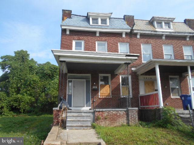 Spacious four bedroom all brick townhome in convenient location. Open main level floor plan with hardwood flooring. The home features a huge covered front porch. Plenty of street parking and great access via the rear alley. Unfinished basement is ready for imagination.