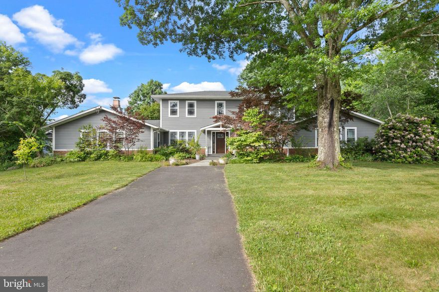 Serenely nestled on 4.4 bucolic acres, (1 1/2 acres fenced) this totally remodeled and expanded home is now over 4100 sq ft ...Private but  just minutes from New Hope and Peddlers Village. Quality workmanship and materials throughout. The Stunning Great Room (35x 23) with Cathedral ceiling, beams, see-thru floor to ceiling fireplace, custom wet bar great and beautiful oak floors. The Gorgeous gourmet kitchen is perfect for entertaining with 2 dishwashers, 2 ovens, a warming drawer, double sinks, 2 Refrigerators  (one beverage), a 53 sq ft Island with prep sink and seating , Quartzite counter tops, tons of cabinets and window seating. There are 4/5 spacious bedrooms, with 2 of them master suites (one on the first floor).  Four full baths all with heated floors and heated towel racks. The large 1st floor Office, Den or 5th bedroom allows for great flexibility if working from home. You'll find many special, well thought out features throughout the home - "Smart" lighting, wood floors throughout (some with custom in-lays), great moldings, finished basement (800Sq ft) , Electric outlet in garage for EV charging, central vac ,a large beautiful deck off the 2nd floor master,  home generator & much more! The 36 x36 garage has height enough for your RV, Boat or 6 cars! Stone terraces, Gazebo, fencing, great views, beautiful gardens.... Fruits trees and berries, specimen trees and shrubs, beautiful perennials and spring bulbs . Even make your own Beer- hops growing on the rear wall of the garage.
Replaced state-of-the-art septic system, Geo-thermal heating/cooling with low electric costs (approx $200 month), Roof reinforced for future solar panels (with conduit pipes installed). Home was rebuilt and expanded from original ranch from the studs - everything was replaced. Basically a less than 10 year old home.
 Wider doorways downstairs for handicap accessible.