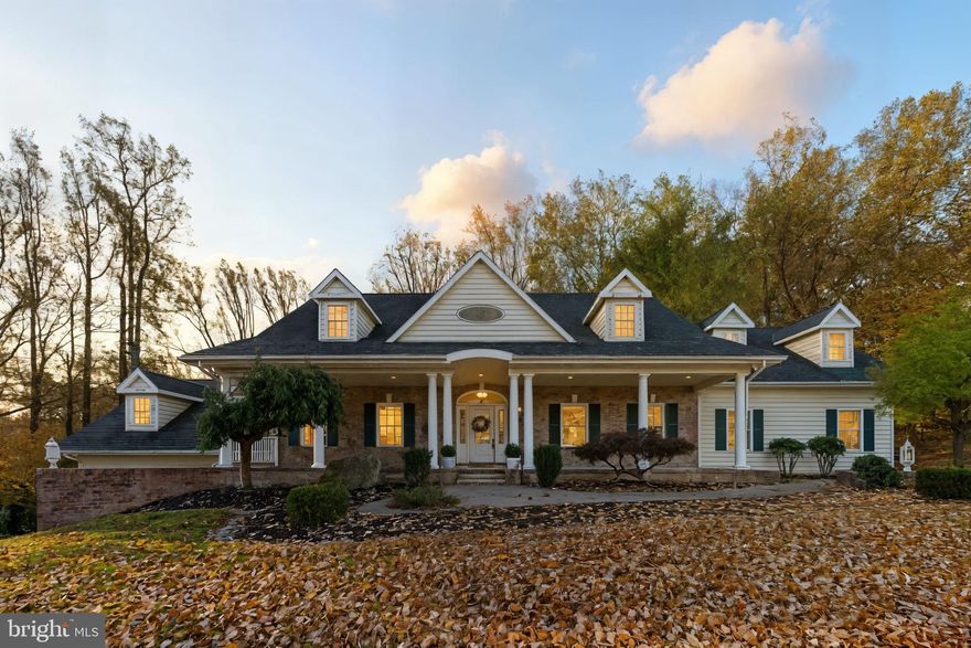 Welcome to a Grand yet Inviting Retreat in the Prestigious River Downs Golf Community
Enjoy refined living in this custom-designed, one-of-a-kind residence that blends timeless elegance with everyday comfort. Thoughtfully envisioned and meticulously built by its original owner, no detail was overlooked in creating a home that is both luxurious and livable.

Step onto the charming covered front porch and prepare to be impressed. The dramatic two-story foyer with an upper-level overlook sets the tone, while a graceful double staircase leads you into the heart of the home — a light-filled main level designed for open, effortless living and entertaining.

The spacious family room opens to a gourmet kitchen, flooded with natural light and framed by expansive windows offering breathtaking views. Radiant heated floors and a cozy gas fireplace provide warmth and ambiance during cooler months.

The serene primary suite is a true sanctuary, complete with a striking corner stone fireplace, an oversized walk-in closet, and a spa-inspired bath featuring a soaking tub and dual-entry, double-seated shower.

Two additional main-level bedrooms each enjoy private en-suite baths, generous walk-in closets, and elegant French doors opening to a shared balcony — perfect for morning coffee or quiet evenings.

The home has been curated to the owners' tastes over the years and is ready to be enjoyed or easily updated to the new owners' preferences. At an entry level price for this sought after neighborhood the potential is primed and ready!

This remarkable home is filled with thoughtful upgrades and distinctive features, including soaring 9-foot ceilings that enhance the sense of space and light, and abundant closet and storage areas throughout. The back of the home looks like something out of Southern Charm with a double balcony overlooking multiple outdoor living spaces ideal for entertaining or relaxing. Enjoy views of the fairway, and the neighborhood's favorite sledding hill right from your massive back porch. This property offers a truly seamless connection between indoor elegance and outdoor tranquility.

Car enthusiasts or hobbyists will appreciate the two separate 2+ car garages. Park in the upper garage and reserve the expansive lower-level garage, complete with commercial doors, for workshops, collections, or creative pursuits.

This home also includes a versatile upper-level suite, ideal for an au pair, in-laws, multi generational living or that kid who just came home from college. The 1 bed, one bath apartment has a full kitchen, living space, W/D and separate entrance.

Both levels of the home have access that avoid stairs with bedrooms on each level so it is perfect for families who need to spread out or need main level bedrooms.

With its captivating Southern Cape/Victorian-inspired exterior and unique, thoughtfully designed interior, this home is a unique gem in River Downs.