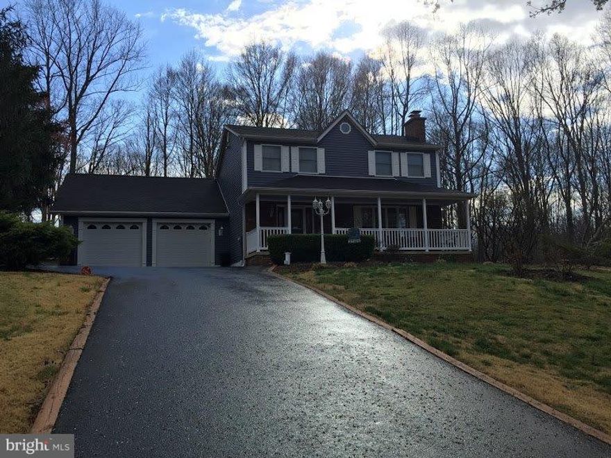 Beautiful country colonial on over 2 acres!  Home has been updated with wood laminate flooring, newer kitchen appliances, granite counters & backsplash.  Dining room off kitchen w/doors open to 12 X 24 deck perfect for back yard cookouts & entertaining.  Living Room w/fireplace w/wood insert, wood trim & chair railing.   Upper Level includes 3 spacious bedrooms including a master suite and private bathroom.  Basement includes laundry area, additional full bathroom & finished recroom.  Lots of room for guests and storage.  Oversized 2 car garage with both front & rear load access doors.  Attic storage.  Amish Built Storage Shed w/electric 14 X 24.   Close to schools and shopping.  Excellent Northern location for DC and Northern VA commuters.  Call showing service for an appointment today.