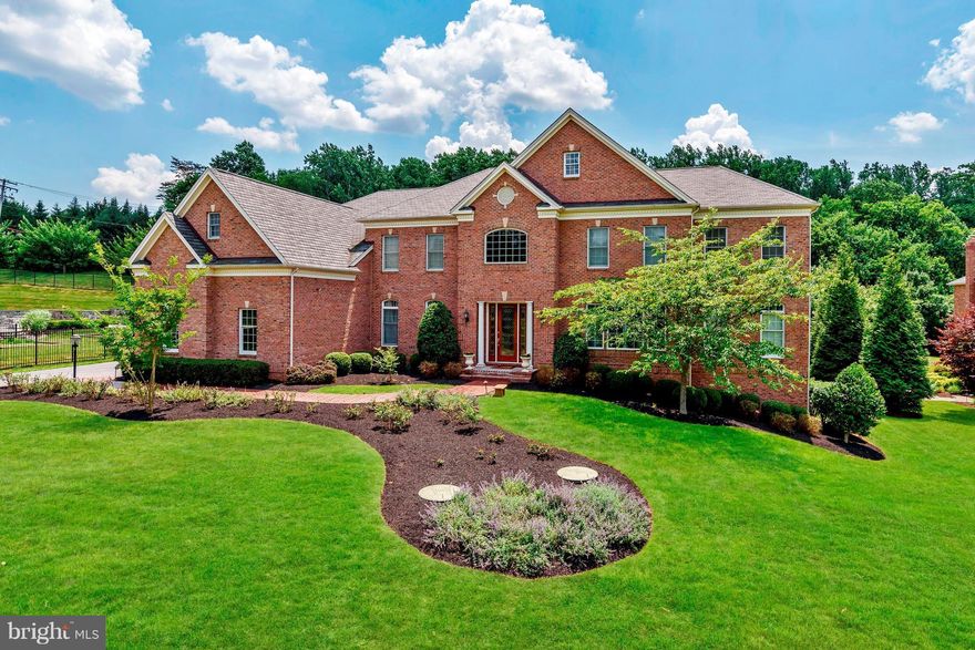 Beautiful all brick luxury home offers intricate detail throughout! Grand 2stry foyer w/dual sweeping staircases& marble floors, elaborate accent moldings, sunroom, gourmet KIT w/large granite brkfst bar, island, high end SS appls& Morn Rm. 2stry FR w/gas FP. Huge MBR suite w/sitting rm, dual walk-ins & LUX MBA! Nestled on 1 acre w/large stamped concrete back patio& Trex deck backing to trees!