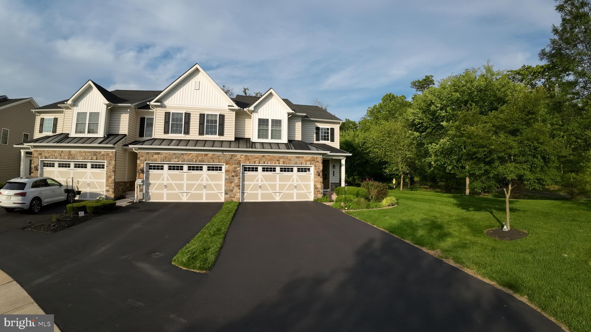 This immaculate end unit, cul-de sac townhome is luxurious and ready for you to call your own! This home has an oversized 2 car garage, rear deck, side yard with sidewalk, landscaping and view of the tree lined trail. In the heart of Colmar with easy commute options with the train, Route 309, and the turnpike access. Close to Lansdale, Montgomeryville, Hatfield and 202 to Doylestown. Enter the warm, bright foyer to a modern feel with rich hardwoods, high ceilings, 1st floor main bedroom suite with a fabulous shower, extra large walk in closet tucked away from the kitchen. The kitchen boasts an island, stainless steel appliances, beautiful granite and open view of the floor to ceiling stone fireplace. The lower level is where all the fun begins! A professional style gym room, bar and rec room! Full bathroom with stall shower, mechanical room with HVAC humidifier and hydro back up, top notch security and wi-fi / network system in closet. The upper level is spacious with three additional bedrooms, large closets and a full bathroom with tub. Bedroom 2 boasts built in window seat and storage for play things and built-in closets by design touches. Rear Deck awning. This home has so many features that they are too many to list! Over $110k of upgrades when the home was purchased from the builder! This will not last long! Close to the Colmar train station, Montgomeryville Mall and shopping, major thoroughfares making this a dream location for a commuter! Easy travels to Philadelphia, Doylestown, Allentown, Quakertown!