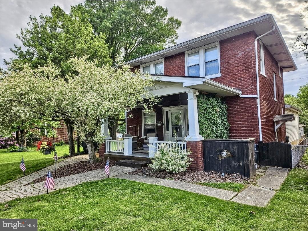 Travel down the quiet tree lined street to this classic two-story brick home with covered front porch and attached in law suite. Main home has 3 beds/1 full bath with new a/c unit, efficient gas heat, new counter tops, paint and flooring on 2nd floor. In law suite is equipped for wheelchair access with kitchen, living room, bedroom with laundry, walk in closet, full bath and side deck for entertaining. Perfect set up if you need additional space for relatives, children, etc.