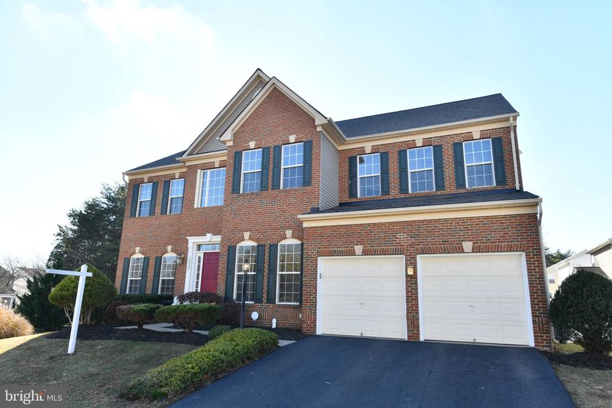 OPEN HOUSE SATURDAY & SUNDAY!  Backing to woods with common area on one side, this stately brick colonial offers a desirable setting within popular Broad Run Oaks!  Relax on the extensive Trex decking & watch your loved ones walk to the community pool just moments away or play in the privacy fenced backyard.  Many appealing interior features....Oversized center island kitchen with Smart Hub technology, main level hardwoods, 10' ceilings.  Finished, walkup lower level boasts a recreation room with bar 'nook', exercise room (possible media room), full bath, game area and plenty of storage.  Incredible primary suite with huge walk-in closet (two separated sections), private luxury bath & sitting room with surround speakers and projection TV!  Freshly custom painted interior, updated HVAC & new roof!