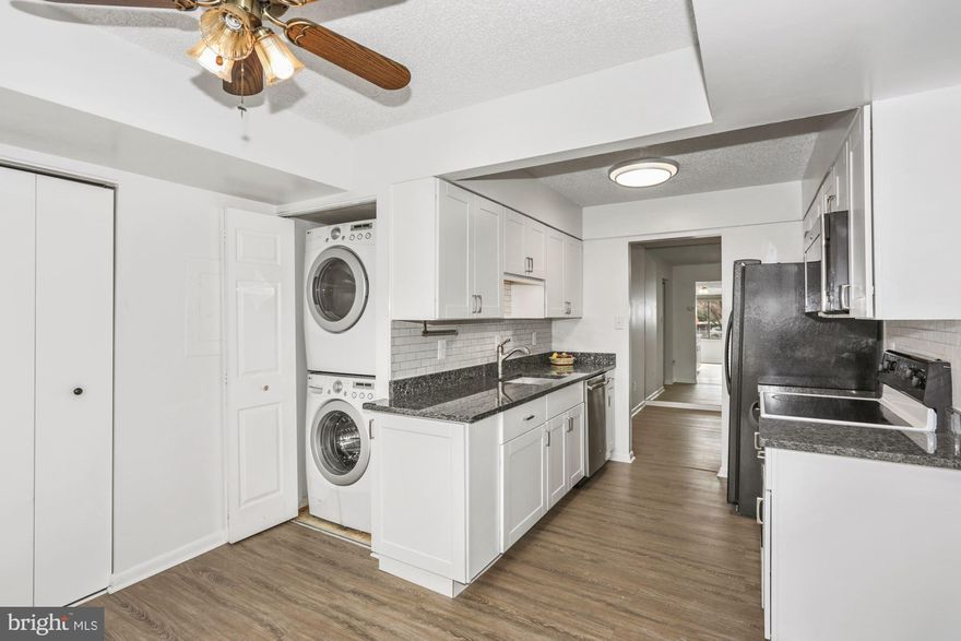 Lovely, Updated Patio unit condo in the heart of Oakton!  Located in a community less than 2 miles to the Vienna Metro station (Orange line), easy access to major commuter routes, and near Grocers and other conveniences. Gorgeous updated kitchen, appliances, flooring, baths, Heat Pump and windows. Freshly painted, new carpet in Master bedroom, brand new master bath renovation with shower with seat and low rise access. Updated Luxury Vinyl Floors with a hardwood look throughout the unit except master bedroom. Plenty of storage in kitchen in through out the unit. Multiple closets throughout. Most every window is updated and enery efficient. Full size LG stacked washer and dryer. Kitchen with grantie tops, glossy white subway tile backsplash, white cabinetry accented by brushed nickel cabinet handles, top of the line dishwasher, side by side refrigerator. Builtout sunroom provides a ideal office space and access to patio. Lots of sunlight. Unit faces South. Front door faces east. Master bedroom with huge walk-in closet, brand new carpet and renovated bath. Spacious secondary bedroom with large closet and luxury vinyl tile. One-year old Heat Pump.  Large, updated slider-windows (except for one) with vertical blinds. Private views from windows and tall hedges on patio provide a perfect oasis. The community has an outdoor pool, clubhouse, tennis courts, and mature trees and shrubs and lush green space.   NEW SOUND BARRIER WILL BE RE-ERECTED THIS  AUGUST