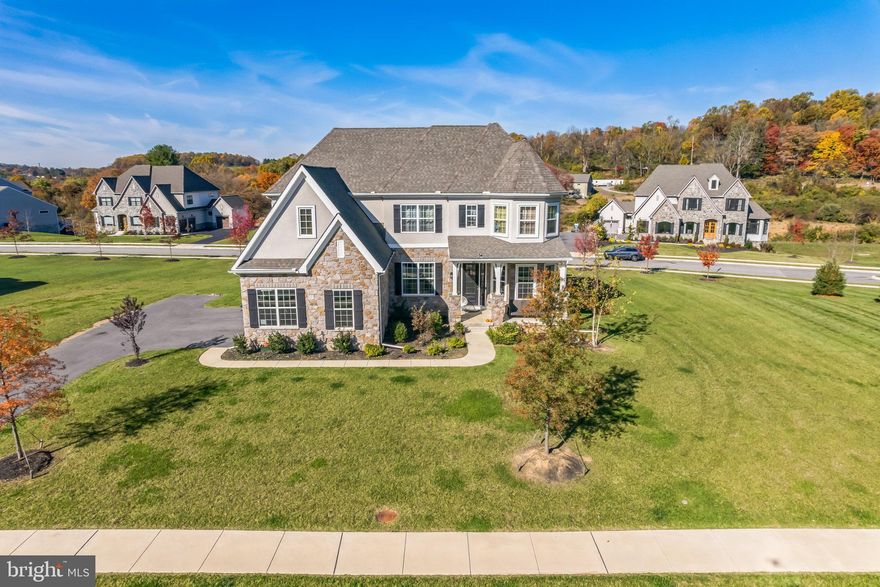 Exquisite Hawthorne Manor-Style Home in Ventry at Edgmont Preserve. Welcome to the lap of luxury in this meticulously designed and beautifully appointed home. Located in the charming Newtown Square, PA, within the prestigious Ventry at Edgmont Preserve community, this Hawthorne Manor-style residence offers an exceptional blend of elegance, style, and modern convenience. A sprawling 6200 square feet of living space, providing ample room for all your lifestyle needs. Situated on one of the largest lots in the development, offering a sense of spaciousness and privacy.This home was thoughtfully constructed in 2021, making it virtually brand new. Nestled in a brand-new community adjacent to Ridley State Creek Park, you'll enjoy seamless access to nature with a pathway connecting directly to the park. Ideal for hiking, fishing, dog walking, or simply immersing yourself in the serenity of the outdoors. Highly-rated school district for elementary, middle, and high schools, making this the perfect setting for families. Surrounded by picturesque scenery, you'll relish the beauty of your surroundings every day. The first level is designed for open concept living, featuring a spacious kitchen, breakfast room, living area, and access to an outdoor deck. The kitchen is a chef's dream with builder-upgraded features, including high ceilings, top-of-the-line appliances, soft-close cabinets, and a generous island. Cabinet display lighting adds a touch of elegance. The breakfast room offers wood panel upgrades and an abundance of natural light. The living room has been thoughtfully upgraded with tall wood panels, creating a visually stunning space. A formal living room features Marrakech panels on the wall. The living space is incredibly generous, providing ample room for relaxation and entertainment. The master bedroom is a true sanctuary, offering ample space and a spa-like bathroom. You'll never want to leave! There's no shortage of closet space, ensuring your belongings are well-organized. A custom outdoor deck with a grill and rotisserie attachment, as well as an outdoor fridge, is perfect for hosting outdoor gatherings. The deck is generously sized and features a pavilion with night lights on the stairs and railings, providing ambiance and safety. Additional flashlights outside the house on the deck side add to the charm. A 1,200 square foot finished basement comes complete with a full bathroom and a bar attachment. It's an ideal space for entertainment and recreation. Your security is a priority with 360 Ring Cameras installed around the property. Custom closets, garage remodeling, and a Tesla Fast Charging Port add convenience and style. Wainscoting, paneling, and fine woodwork throughout the house add a touch of elegance. An outdoor sprinkler system with winterization package ensures your landscape stays lush. Soft water treatment for the whole home is also installed. Enjoy the benefits of a pet-friendly community with low HOA fees. As a resident of Ventry at Edgmont Preserve, you'll have access to a range of community amenities, including a clubhouse and pool, sports courts, and scenic walking trails. The clubhouse hosts various activities, from book clubs to games nights, and offers a fully accessible gym and wifi-equipped spaces. During the summer, a medium-sized pool and a jacuzzi are perfect for relaxation. An oversized three-car garage ensures you have ample space for your vehicles and storage. Don't miss this rare opportunity to own a stunning home in a highly sought-after community. Contact us today to schedule your private showing and make this luxurious property your own!