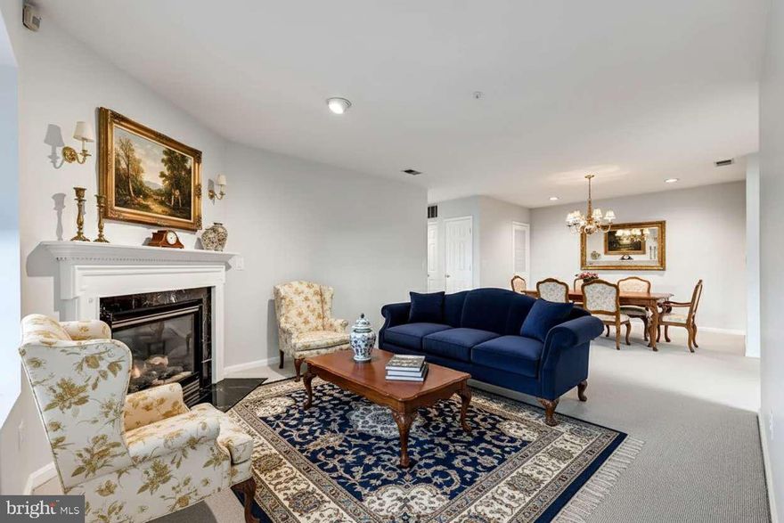 Motivated! Wonderful opportunity! Welcome to your easy-living home in the conveniently located Tullamore Condominium community, situated in the desirable Mays Chapel neighborhood across the street from all your shopping and restaurant needs.  This well maintained 1st floor unit offers easy access to its interior. The condominium has been freshly and neutrally painted, providing a clean and inviting ambiance all while enjoying the comfort of the newly installed Berber wall-to-wall carpeting. Enter through your own private side door for added convenience, or use the front door access to welcome your guest properly. The spacious living room and dining room combination features a cozy gas fireplace, creating a warm and inviting space for gathering. The large eat-in kitchen boasts ample storage and newly engineered flooring, making it a delightful space for cooking and dining. A laundry/utility room nearby adds to the functionality of this space. The primary bedroom offers double exposure, filling the room with natural light, along with an adjoining full bathroom and walk-in closet. An additional room can serve as a 2nd bedroom, office or den, providing flexibility to suit your needs with a hallway full bathroom. Why not come relax on your covered patio with the charming hunter green awning perfect for your enjoyment...awning installed, removed and stored at Loane Bros for addl fee. Photos will furniture are "virtually" staged.