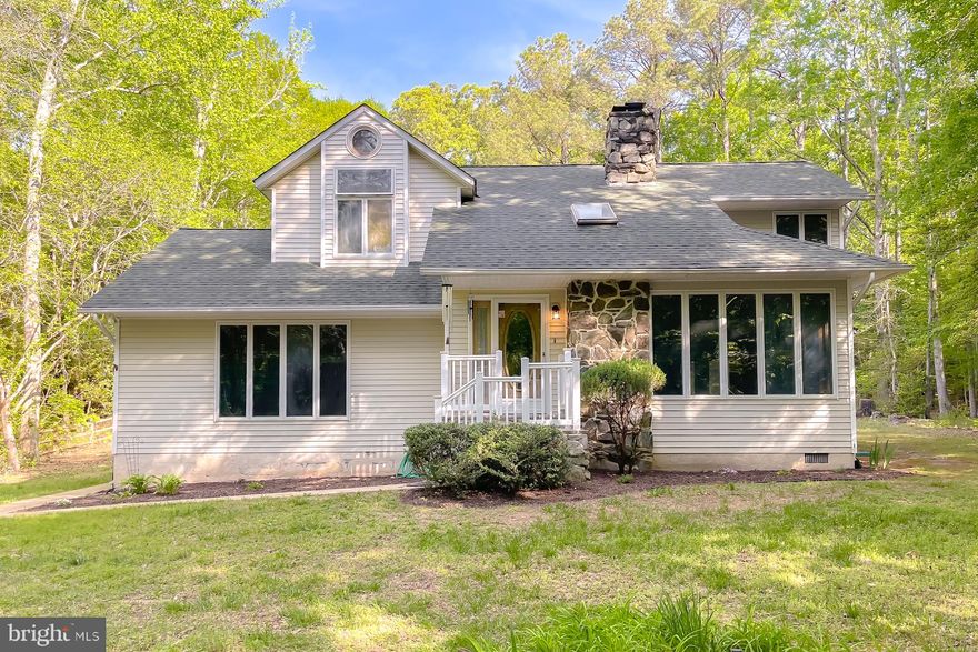 This contemporary cape cod style home is it's own private retreat on over 3 acres.   The main floor gives you a formal living room with vaulted celing and 2 sided woodstove/fireplace while also providing an additional family room that could easily be converted to a 3rd bedroom.  The kitchen has been updated with granite counter tops, subway tiled backsplash, new appliances and more.  Dining room surrounded by windows to enjoy the view of the woods and a mud room with washer/dryer and ample storage. Upstairs you'll find 2 large bedrooms with a loft room in between accessing a 2nd level deck.  Full bathrooms on each floor, the upper one remodeled to give a spa like feel. 
Plan your summer parties with the 9600 gallon heated pool, hot tub, and screened gazebo on extensive decking.    Shed also included for additional storage.   Community has a lake that is an easy walk from the house.