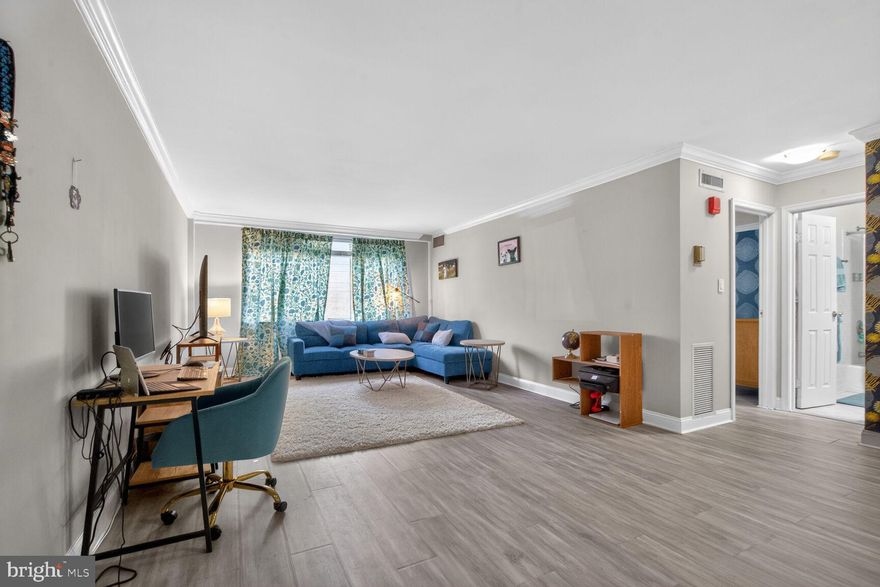 Enter to style, space and light with this elegant condo with a very desirable floor plan in The Whitehall Condominium. A renovated lobby with concierge welcomes you to the building. Recently renovated, the condo features modern flooring, elegant crown molding, and expansive picture windows that flood the space with natural light.   Enter the unit to a large double door coat closet.  The open floor plan has a spacious Living Room/Dining Room combination, perfect for modern living. A newer kitchen features ample white cabinetry and lighting that adds to the kitchen’s ambiance. Updates include a renovated bathroom with ceramic tile, sink with vanity with granite countertop.   The bedroom is large enough for a king bed, desk and additional furniture.  Although it is a first-floor unit, it sits well above the ground.   Amenities include an outdoor swimming pool, sunning spaces, a club house, Bar B Que and a fitness center. The unit comes with two assigned parking spaces. Invite guests - there are plenty of guest parking behind the building, very rare in Bethesda! The monthly condo fee includes all utilities (except internet). The Bethesda Metro, shopping and dining at all of the stores and many restaurants that Bethesda has to offer are blocks from your door.