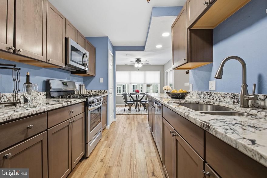 Completely remodeled in 2021, this beautifully updated condo offers a modern yet timeless feel with thoughtful upgrades throughout. The home features a stunning new kitchen with stainless steel appliances and granite countertops, fully renovated bathrooms, new windows, new HVAC system, new hot water heater, updated electric, and luxury vinyl plank flooring flowing seamlessly through every room. A screened-in porch provides the perfect spot to relax and unwind, blending indoor comfort with outdoor enjoyment. Residents enjoy low-maintenance living with community amenities that include snow removal, a pool, fitness center, and a gazebo with picnic area. Ideally located close to shopping and scenic walking trails, this condo is perfectly tucked away while still being right in the heart of Bel Air—offering the best of both convenience and tranquility.