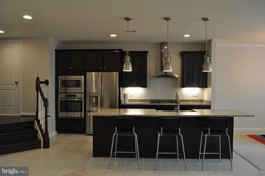 Gorgeous Brand New TH w. 2 car garage. Top of the line kitchen w. Stainless Steel appliances, farmhouse sink, 5 burner gas cooktop, wall oven, built in microwave, granite counters, 12X12 tile flooring. Huge granite island easily accommodating 4 barstools. Dining & spacious family room combo w. gas fp. W/o to stone patio w. firepit overlooking common area. Laundry BR lvl. Walk in closet in all BRs!