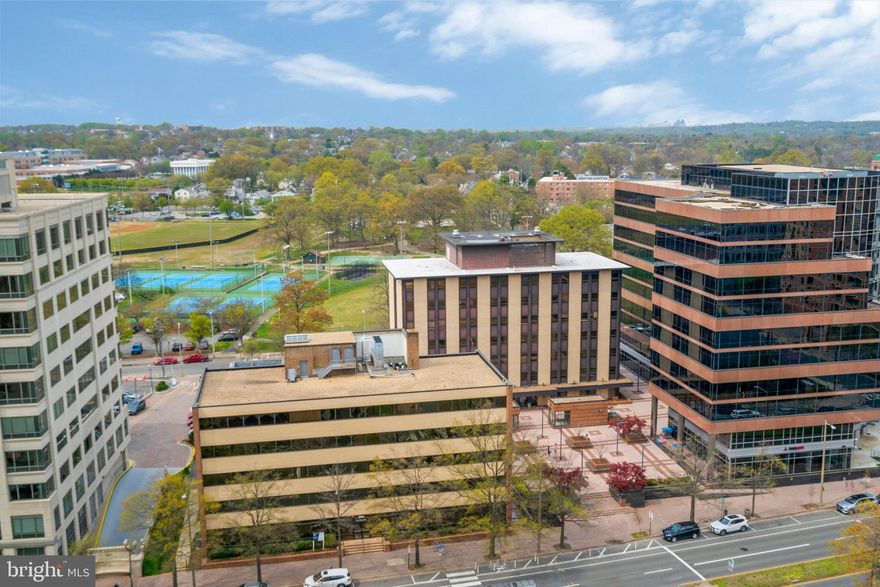 HUGE and bright , corner end unit condo located on the 15th floor of Tower Villas with sweeping vistas, balcony, and over 1400sqft of living space. Upgraded kitchen with granite counters and stainless steel appliances, bathrooms, MBA with Jaccuzzi, in unit washer/dryer, hardwood floors, walk-in closets, TWO GARAGE SPACES, storage, a must see!! 1 block from Virginia Square metro and 4.5 blocks from Ballston metro, 98 walkscore. Walk everywhere.  ALL UTILITIES INCLUDED in condo fee, even Fios internet and cable! 24/7r attended front desk, mail and packages held. One of the largest pools in the area.