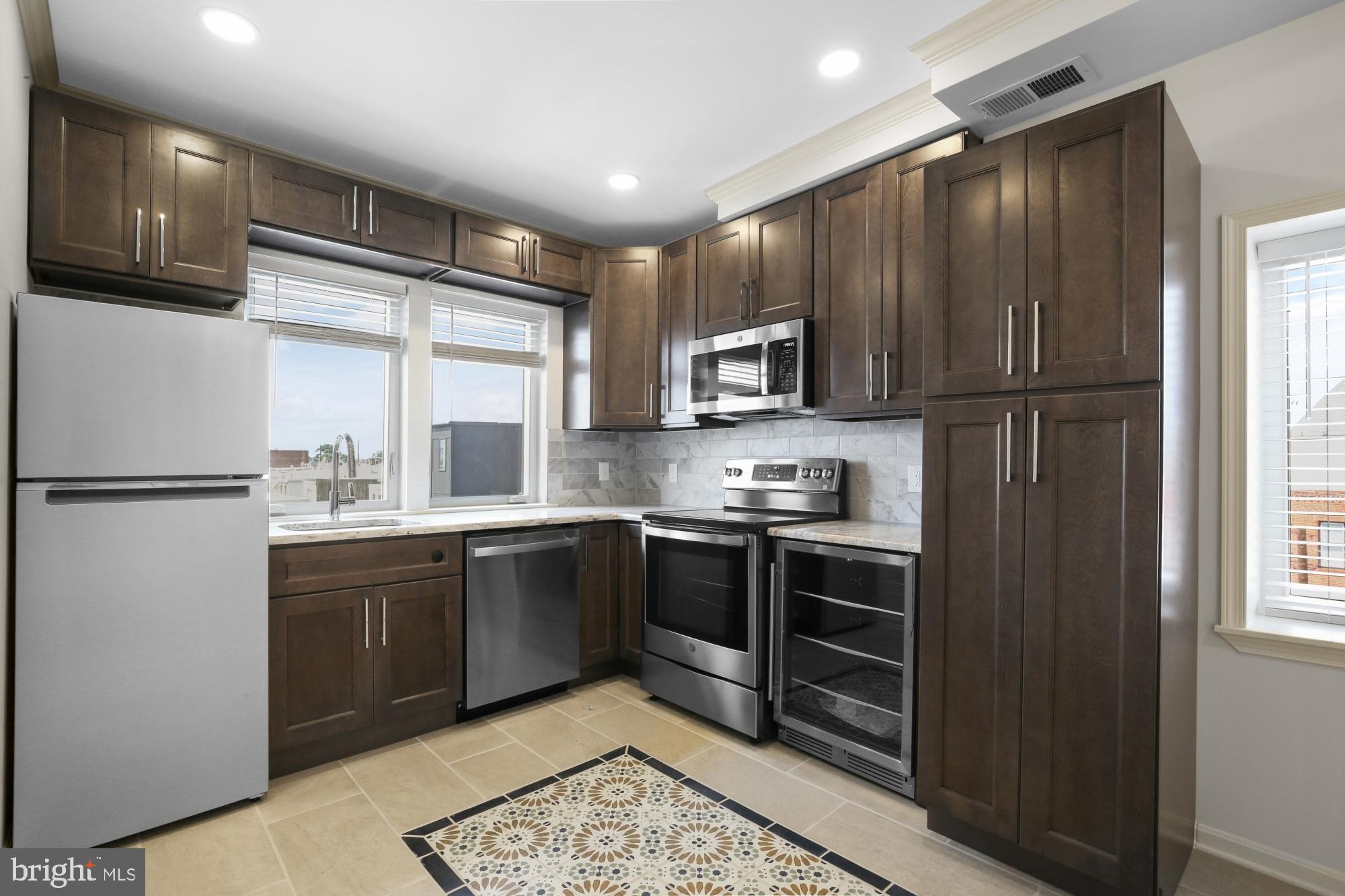 Available NOW:
Welcome to 2528 E Allegheny Ave #3rd Fl! This newly renovated 1 bedroom, 1 bathroom rental apartment features modern updates throughout. Step into the kitchen with ample dark wood cabinetry, a full suite of sleek stainless steel appliances including a wine fridge, and stylish contemporary fixtures. The living space offers wood floors and a ceiling fan for comfort. Continue to your large tiled bathroom, boasting a luxurious walk-in shower, a vanity, and a medicine cabinet. A stacked washer and dryer are conveniently located in the hall. Your sizable bedroom sits at the front of the unit and features recessed lighting, a closet, and a ceiling fan. Head upstairs to your private roof deck and take in stunning views of the city!
Lease Terms:
Generally, 1st month, 12th month, and 1 month security deposit due at, or prior to, lease signing. Other terms may be required by Landlord. $55 application fee per applicant. Cats and small dogs are conditional on owner's approval and may require an additional fee, if accepted. (Generally, $500/dog and $250/cat). Strictly no large dogs. Tenants responsible for: electricity, gas, cable/internet, and a $60/month flat water fee. Landlord Requirements: Applicants to make 3x the monthly rent in verifiable net income, credit history to be considered (i.e. no active collections), no evictions within the past 4 years, and must have a verifiable rental history with on-time rental payments. Exceptions to this criteria may exist under the law and will be considered.