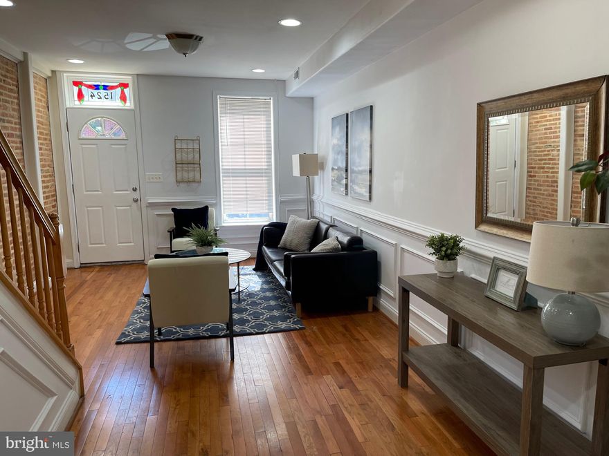 Welcome to this beautifully appointed townhome in historic Federal Hill. Exposed brick and moldings  run throughout to add to the character of this wonderful home. Enter into the living room and dining area with an open floor plan concept and high ceilings. Stainless appliances, granite and and eat in kitchen . Also includes a separate breakfast room or family room which  leads outside to a spacious parking pad. Head up to the second level which features two large bedrooms with 2 full baths the  master bedroom suite has separate shower and walk in closet, adjacent  laundry nook is also easily accessible located on the second floor.  Finally, head up to the third floor room with wood floors and wet bar leading to roof deck with spectacular views of the city skyline and neighborhood all around! Plenty of places in this home to entertain guests including finished lower level. Enjoy all that Federal Hill has to offer with the recently renovated Cross Street Market, shops, restaurants, to the many parks, Inner Harbor water views and of course Baltimore Orioles and Baltimore Ravens sporting events! Easy commute to I95, I83 and the MARC Train Camden rail stop is right up the road for a direct shot to Union Station in Washington D.C