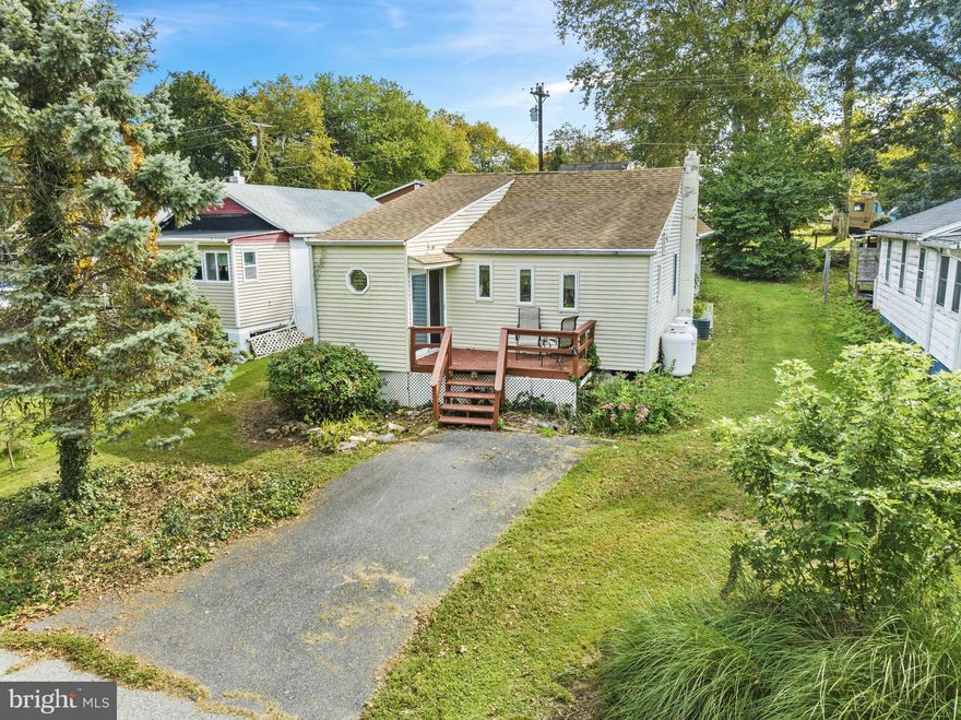 Discover your dream retreat in this charming 2-bedroom, 1-bath cottage that is just a short walk or golf cart ride to the community beach.
This diamond in the rough is waiting for your personal touch! The home offers endless potential for year-round or seasonal living. As you step inside, you'll be greeted by gorgeous hardwood floors that add a touch of elegance to this cozy abode. The bonus room provides ample space for your creative endeavors or can easily be transformed into a home office or guest room – the choice is yours! But here's the real kicker – beach access! That's right, folks, this property is ideal for those who love boating and water activities. Imagine spending sunny days cruising along the Bay or simply lounging on the sandy shores. You'll also have access to neighborhood activities that will keep you entertained all year long. Crystal Beach also offers a private Boat Club membership with a private beach. Parking woes? Not here! With not one, not two, but three parking spaces, you'll never have to worry about finding a spot for your vehicles or accommodating guests. So why wait? Seize this incredible opportunity to own your own slice of paradise in a water-oriented community and let your imagination run wild. Don't miss out on this hidden gem – schedule a private showing today!