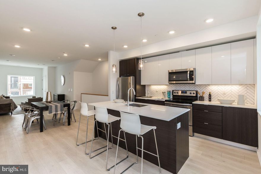 This immaculate apartment is located in the heart of Brewery Row. Now Offering $1,695 net effective rent which is 1 month free on a 13 month lease! Terms and Conditions Apply. The community features 63 townhouse-like apartments, offering a clean and contemporary living with modern, stylish finishes. Each pet-friendly unit features top of the line finishes, upgraded kitchen amenities, and an in-unit laundry. This apartment also features a fenced back yard!

This 2Bedroom 1Bath apartment includes a private roof deck! Also features hardwood floors throughout, modern cabinetry and finishes, stainless steel appliances, and washers and dryers for convenience. This unit blends style, location, and value. Off street is available, private parking is also available for an additional fee.

Schedule your tour today!