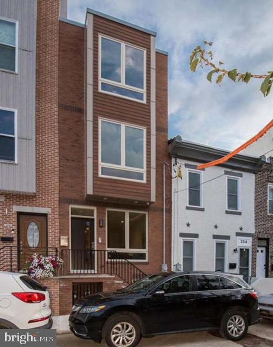 Incredible newer construction house located on a quiet block in Point Breeze! Features include 4bed/3bathrooms & 2400 Sq ft of well designed floor space. Amenities - 2 outdoor spaces, built in surround sound system (1st floor, main bed/bath and rooftop deck), 2 audio visual intercom systems, oak hardwood floors, recessed led lighting, oversized windows and custom metal railings. Open Floor Plan - 1st floor: Custom kitchen with over sized center island, quartz countertops, stainless steel appliances, under cabinet lighting, subway tiled backsplash, coat closet/pantry and access to large private patio, dining room and Living room. 2nd Floor: 2 light filled bedrooms with ample closet space and a luxurious hall bath with floating vanity and modern tile, separate laundry closet with washer & dryer installed. 3rd Floor: Wet bar with custom cabinets and beverage cooler, main suite with huge walk in closet, ensuite bath with tiled walls, floating double vanity, oversize shower w/ frameless glass door. Stairs lead to private rooftop deck with unobstructed views of Center City skyline. Full finished basement ideal for office & guest bedroom and full bath. Great location close to many amazing restaurants and public transportation.