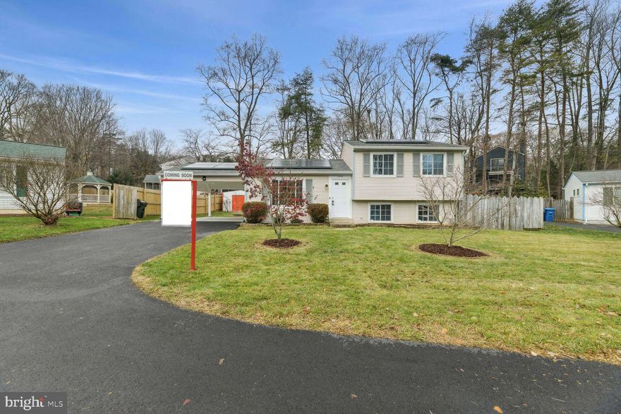Charming and bright 3 bed/2 bath split level home in  Goins Manor neighborhood in Fairfax.  House is being sold by original owners who have spent years updating and modernizing the home, to include Tesla solar panels (2021), tankless water heater (2022), natural gas standby generator (2020), architectural shingle roof (2021), composite decking (2020) and sump pump (2019).   Solar panels are fully paid off!     

The main level has an updated kitchen complete with granite countertops and stainless steel appliances, including a dual fuel oven, newer dishwasher and LG Smart Fridge with InstaView door.  Ample space off the kitchen for full size dining table as well as access to your deck and back yard through large sliding glass doors.  Hardwood floors on the main level living area and throughout the upper level bedrooms.  The lower level is filled with natural light and offers large rec room, full bath, and walk out access to the back yard.  Easily accessible crawl space provides for a great storage option.   Fresh paint throughout the home.   

Fantastically located just 5 minutes to George Mason, less than a mile to Target and in between Braddock Rd and Fairfax County parkway for easy commuting.    The house sits well off the main road on nearly a quarter acre lot.  Flat, low maintenance lot with numerous fruit trees (apples and pears) and additional garden for fruits and vegetables.   Oversized carport for covered parking.   Extremely low HOA fee of $10/month.  Robinson School pyramid.