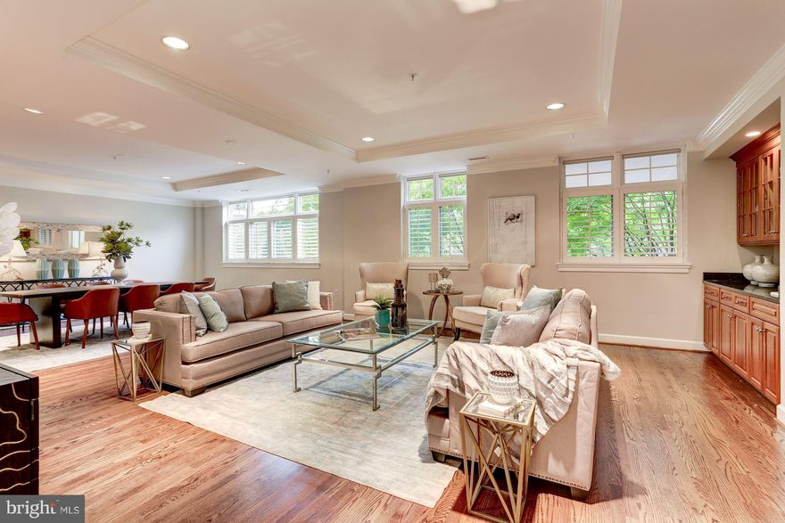 Heart of Bethesda! Stunning! Sits up high! Open living & dining area w/wet bar, Gourmet Kit w/  top of the line appliances & Island  Pantry, Powder room, Den, MB w/ en-suite BA, & 2 walk-in closets w/access to terrace, plus 2 more Roomy Bedrooms (one with terr.access), Full BA, Glorious terrace w/irrigation system, washer & dryer, ample storage,2 car Gar parking, and more! Approx. 2800 ft.