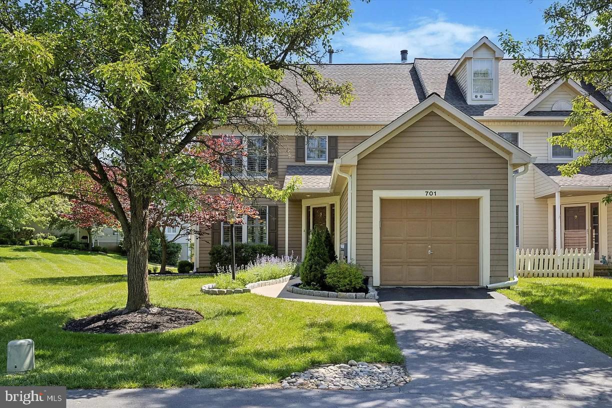 Located just off the Route 52 in Chadds Ford. This end-unit townhome at 701 Kilduff Ct is in the ever popular community of Balmoral . This 3 bedroom, 2.5 bath home offers 3 levels and over 2,000 Sq Ft of finished living space. The living room features lovely shutters and vinyl plank floors that flow into the bright dining room. Off the dining room you find an updated kitchen with wall oven and microwave, stainless steel dishwasher and refrigerator and a large sink. The composite deck has a womderful view of the pond and stairs to access the grassy area behind the home. The updated powder room, laundry room, and access to a one-car garage on the first floor offer such convenience. The second level houses a large primary bedroom, with a vaulted ceiling, walk-in closet, and an updated private bath equipped with a double sink vanity and glass stall shower. On the second floor there are two additional bedrooms and an updated full hall bath. The finished, walk-out basement is perfect flex space and features lots of natural light, a 2-sided, wood-burning fireplace, and storage space. Easy access to Rts 1, to Longwood Gardens, Kennett Square, Wilmington and many businesses, shops and restaurants!
