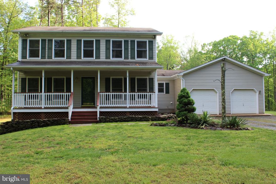 Lovely Craftsman secluded in 5 gorgeous acres.  Privacy galore! Handcrafted built in cabinet's in the formal living room with crown molding, newly remodeled kitchen cabinets, counter tops, sink, dishwasher and microwave.  Deck with steps to patio area. Beautifully landscaped yard and serene backyard with huge flat grassy area. Move in Ready!