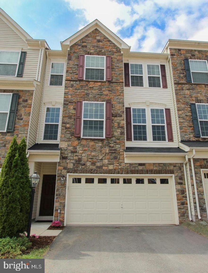 One of the largest townhouse built by Van Metre w/ just over 3000 sqft, featuring 3 finished levels, 3 bedrooms & 2 full and 2 half baths. The main level features 10" ceilings & recess lights throughout. The gourmet kitchen features 42' maple cabinets, granite counters, center island with space for barstools; appliances including double oven, gas cooktop, dishwasher, built-in microwave & refrigerator with icemaker; Adjoining family room is the perfect space to entertain & features a fireplace & door leading out to the deck overlooking the private yard. Main level study room off the living room; The upper level features a spacious master bedroom with sitting area & a walk-in closet. The master bath boasts upgraded tile, a separate shower & double sinks. Upper leave features two additional large bedrooms & 2nd full bathroom. The laundry room  is conveniently located on the upper level. The fully finished lower level features a recreation room with a walk-out to a private, fenced back yard. This home is  easy access to Loudoun County Pkwy, Route 50 & Toll Road. Enjoy nearby restaurants, theater & shopping. Community amenities include - pools, tennis courts, basketball courts, tot lot/playgrounds, walking trails & more!