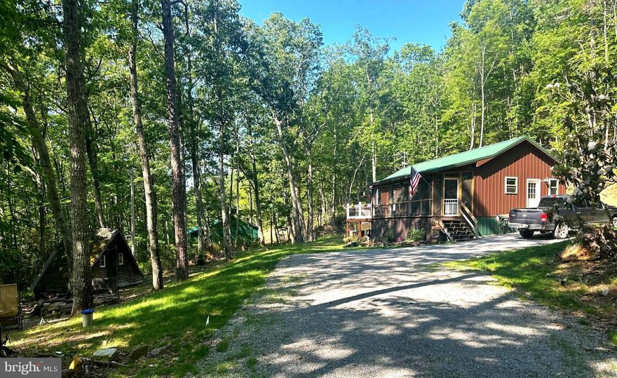 BACK ON THE MARKET-due to no fault of the seller.  COMPLETELY REBUILT & REMODELED in 2022.   The owners have created a cozy living space with abundance of natural lighting.   Walk inside and you will never want to leave. FRESH, CRISP, & MOVE IN READY.  Kitchen is adorned with granite countertops, hickory cabinets and an osmosis water system.  Luxury Vinyl Plank flooring flows throughout the cabin.   A Screened In Porch,  fire pit, reinforced deck space, perfect for your hot tub and over 6 acs to explore, the sights and sounds of nature.  Curl up on the couch with a book by the wood stove in winter and head out to the screened porch with a beverage to enjoy the warm days of summer.  Oversized bedroom with direct access to the deck area.  Maintenance free exterior with metal roof & metal siding.  Just minutes from the quaint town of Monterey for conveniences and dining out.  Minutes from fishing, splashing in the river or hiking.  Don't linger too long before making an appointment for this lil gem amongst the trees!  MOTIVATED SELLERS.